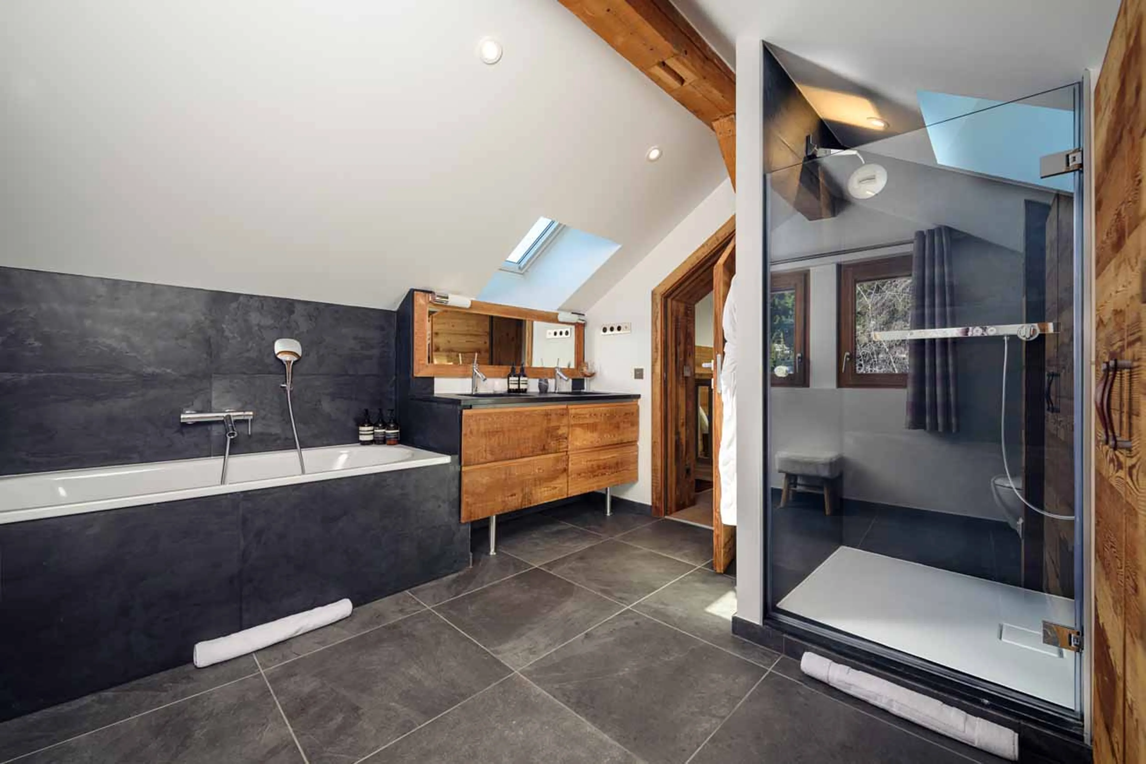 Private bathroom with separate shower and double basin in Chalet La Folie, Meribel