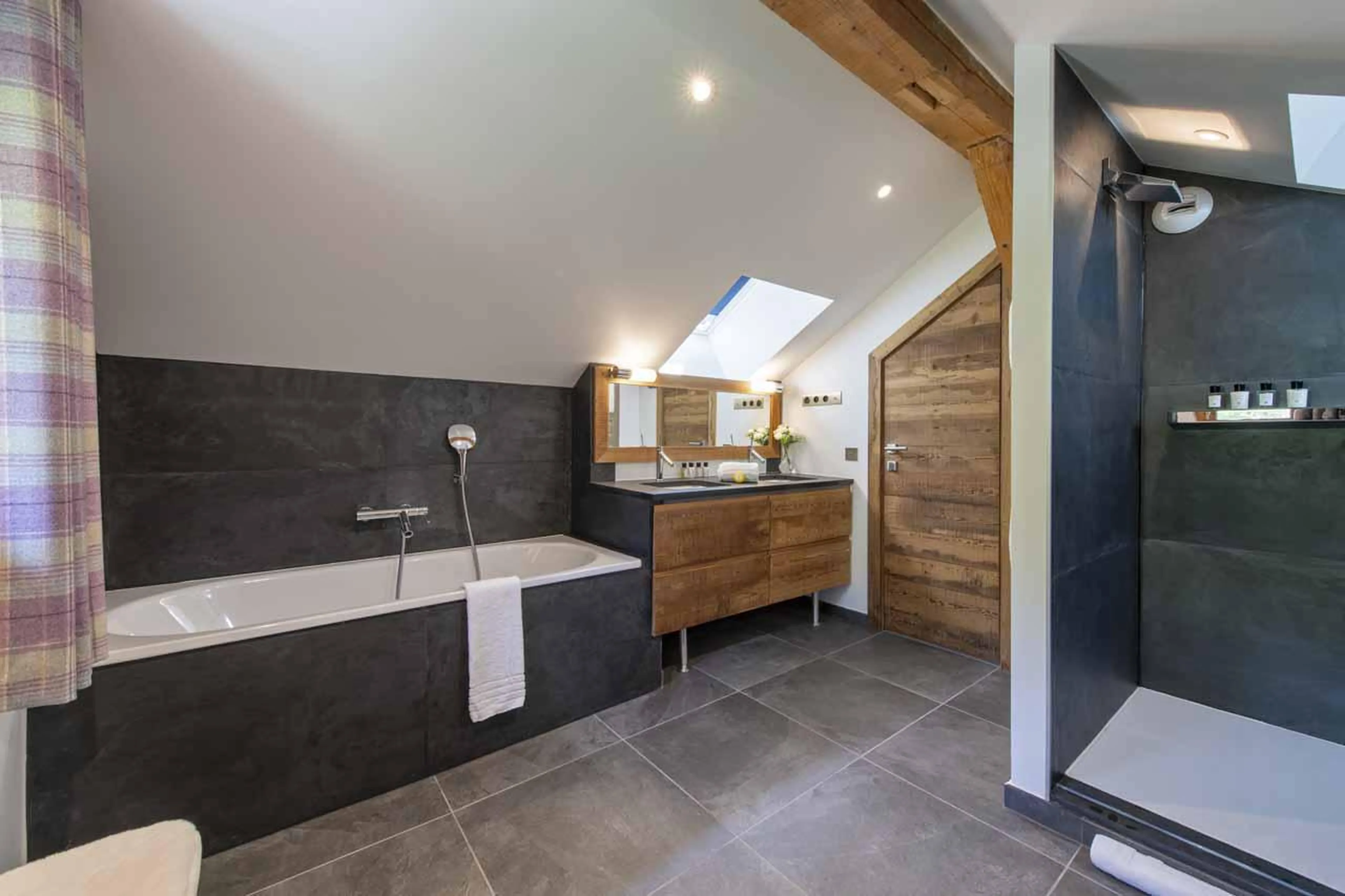 Private bathroom with separate shower and double basin in Chalet La Folie, Meribel