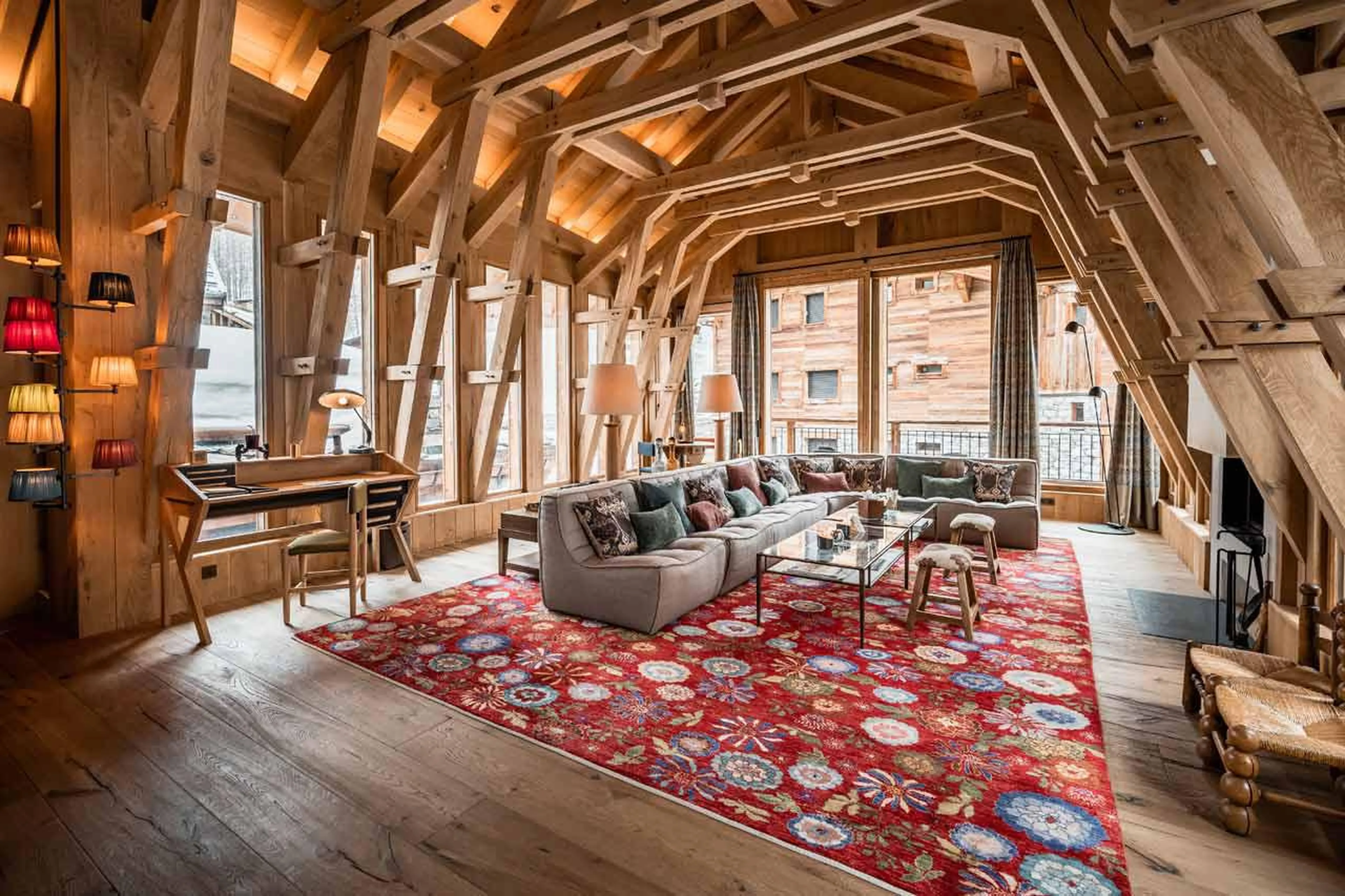 Living room leading to outdoor terrace at Chalet La Grange in Val d'Isere