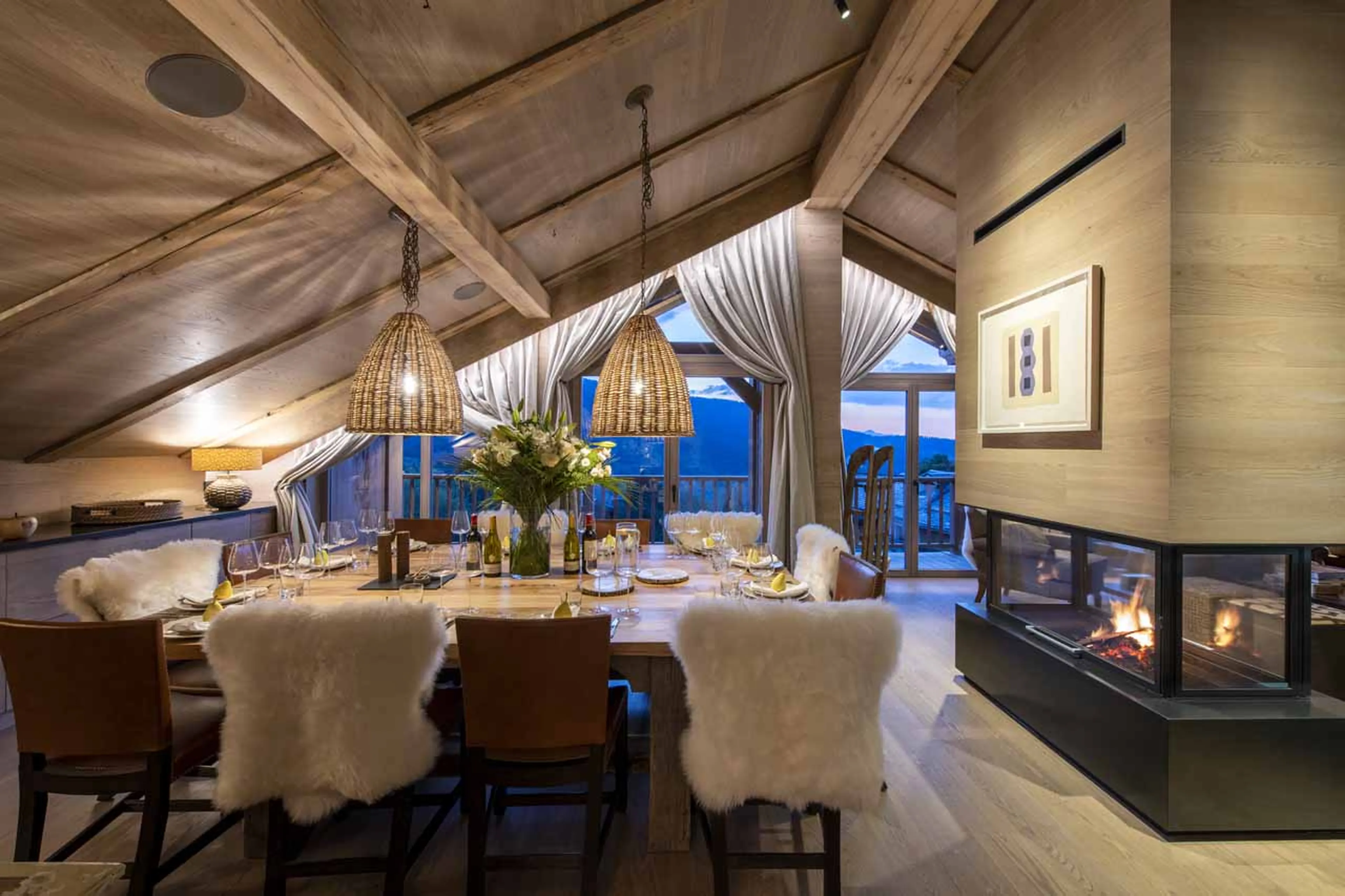 Dining area with doors to balcony at Chalet La Loze in Meribel