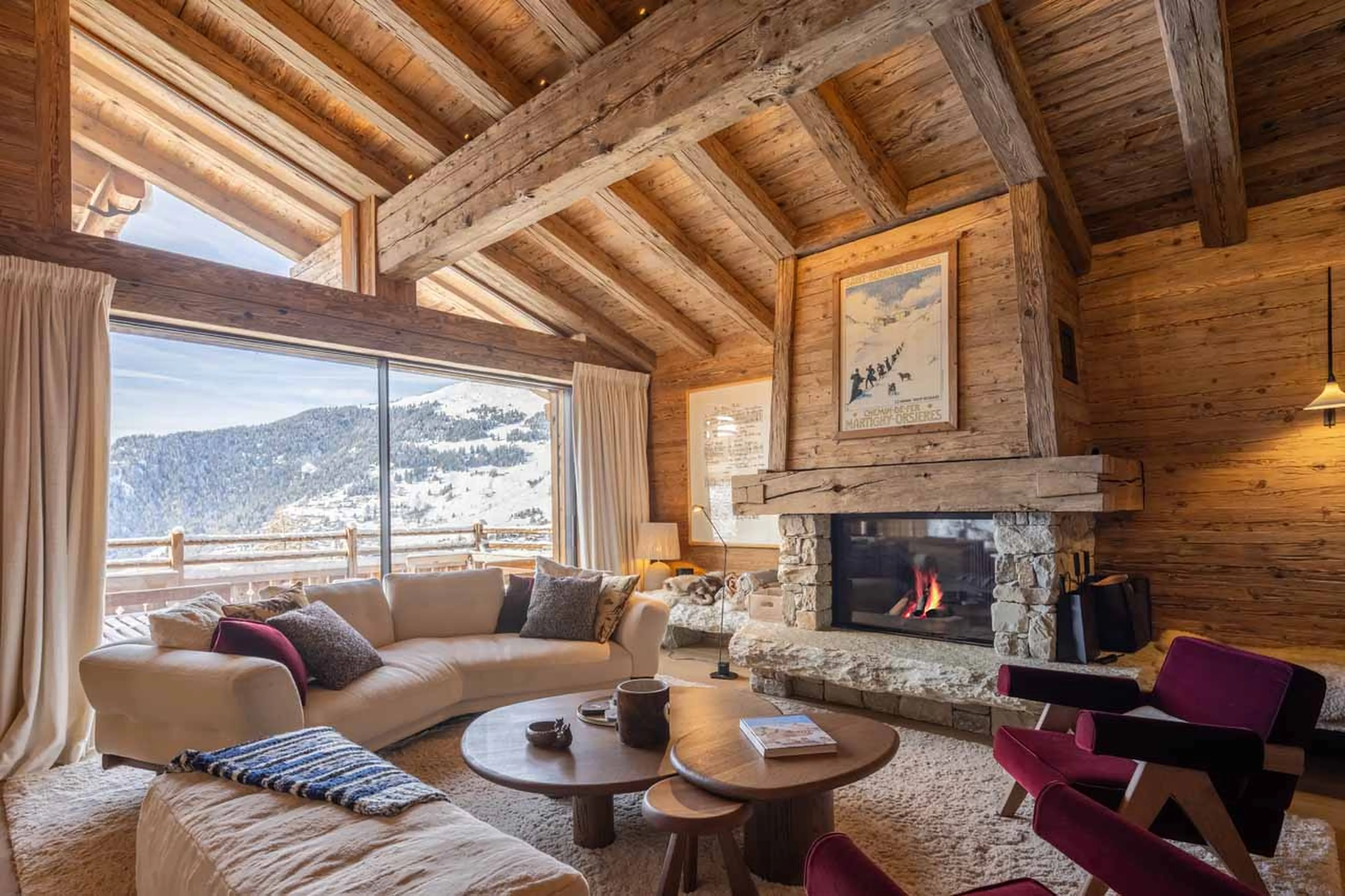 Living room with sofas and fireplace in Chalet La Rochette, Verbier