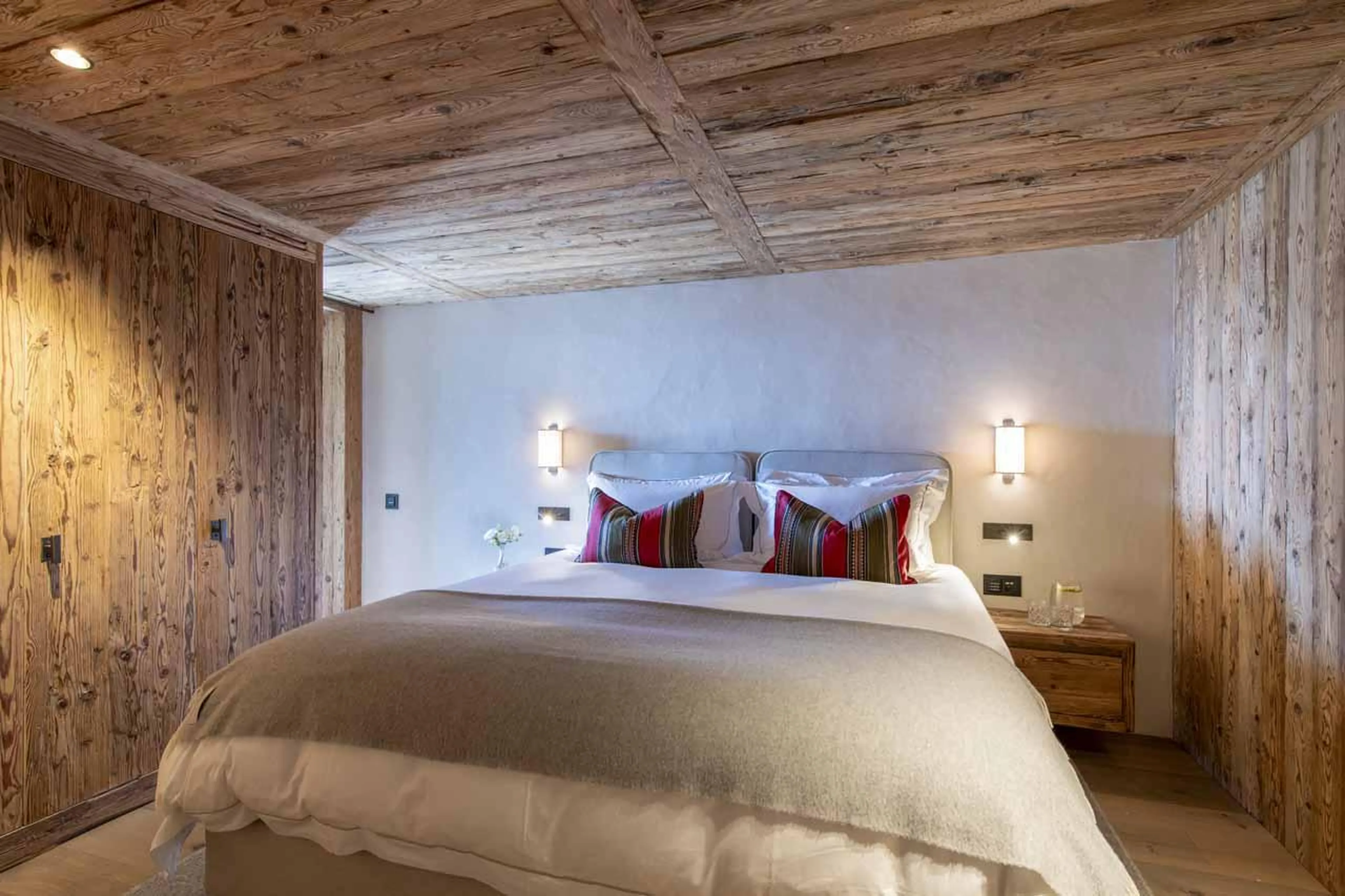 Double bedroom with wooden materials in Chalet La Rochette, Verbier