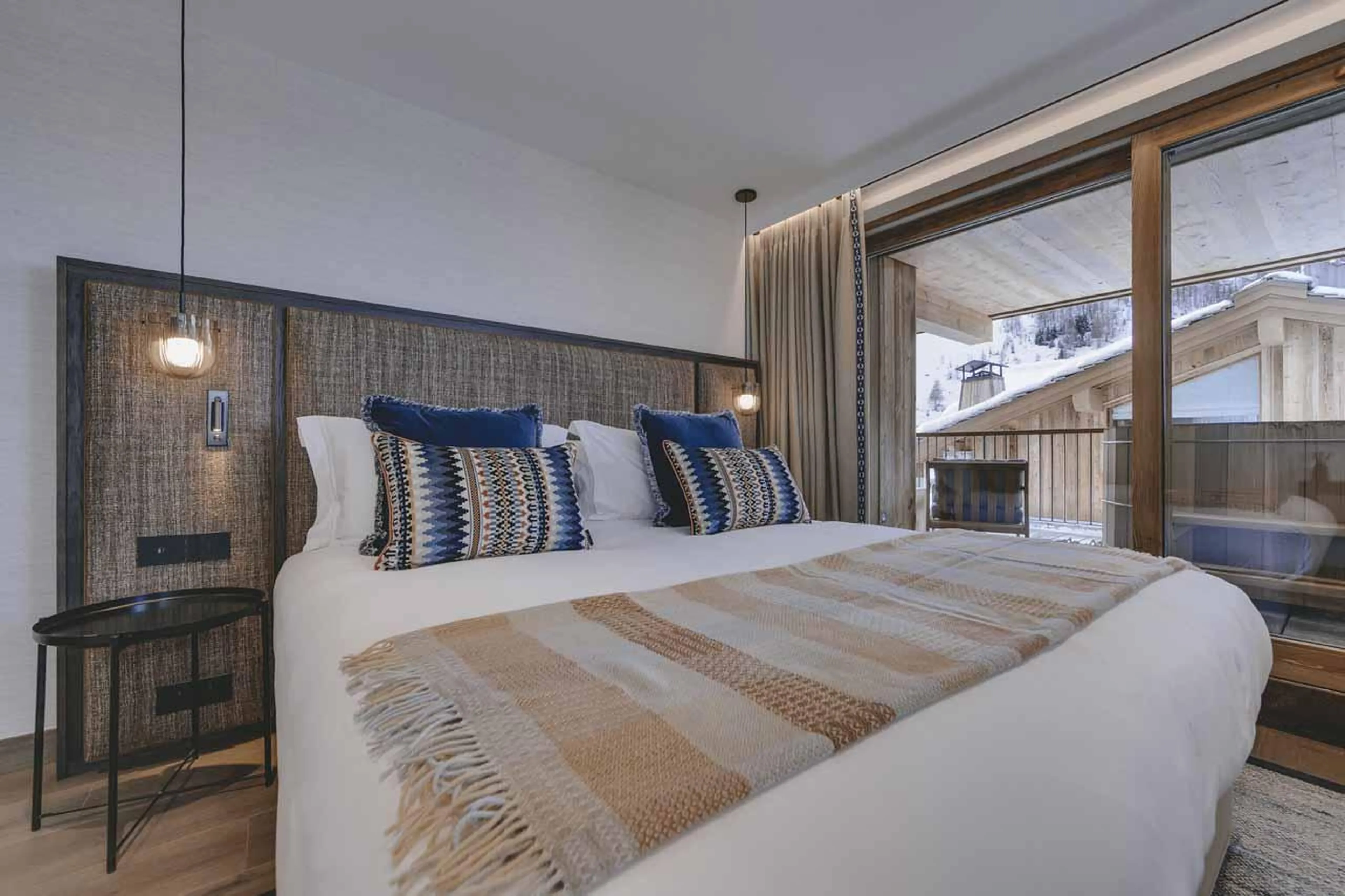 Double bedroom with sliding glass doors at Chalet La Tene, Val d'Isere