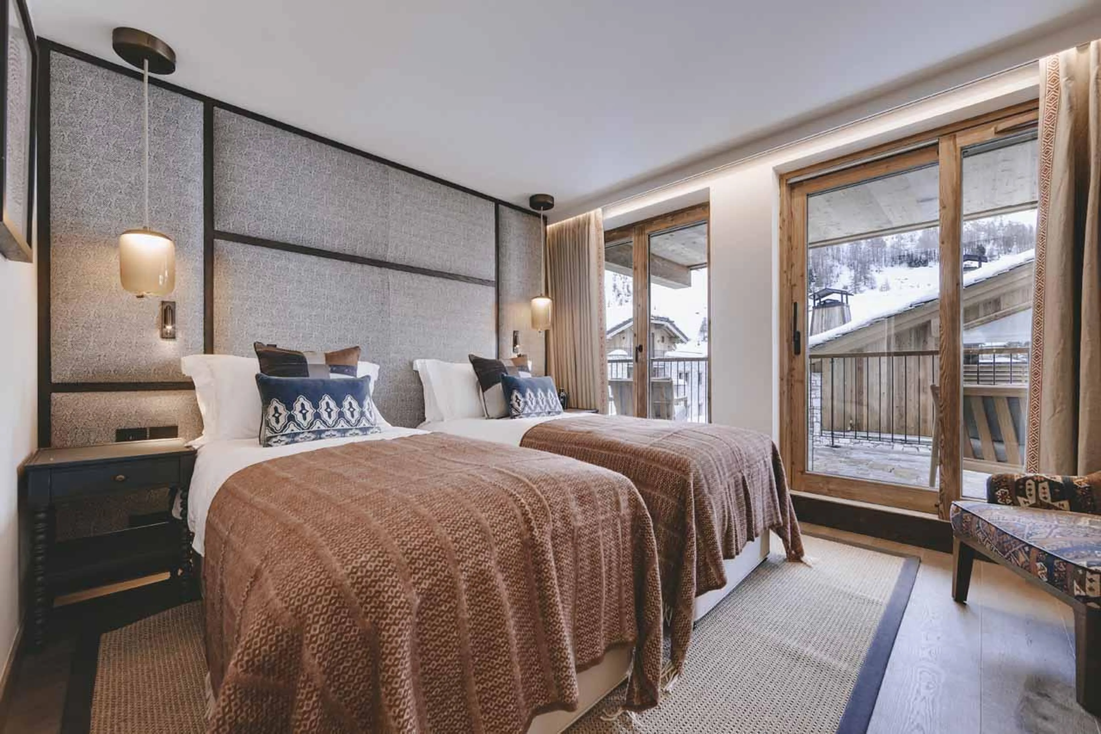 Twin bedroom with access to balcony at Chalet La Tene, Val d'Isere