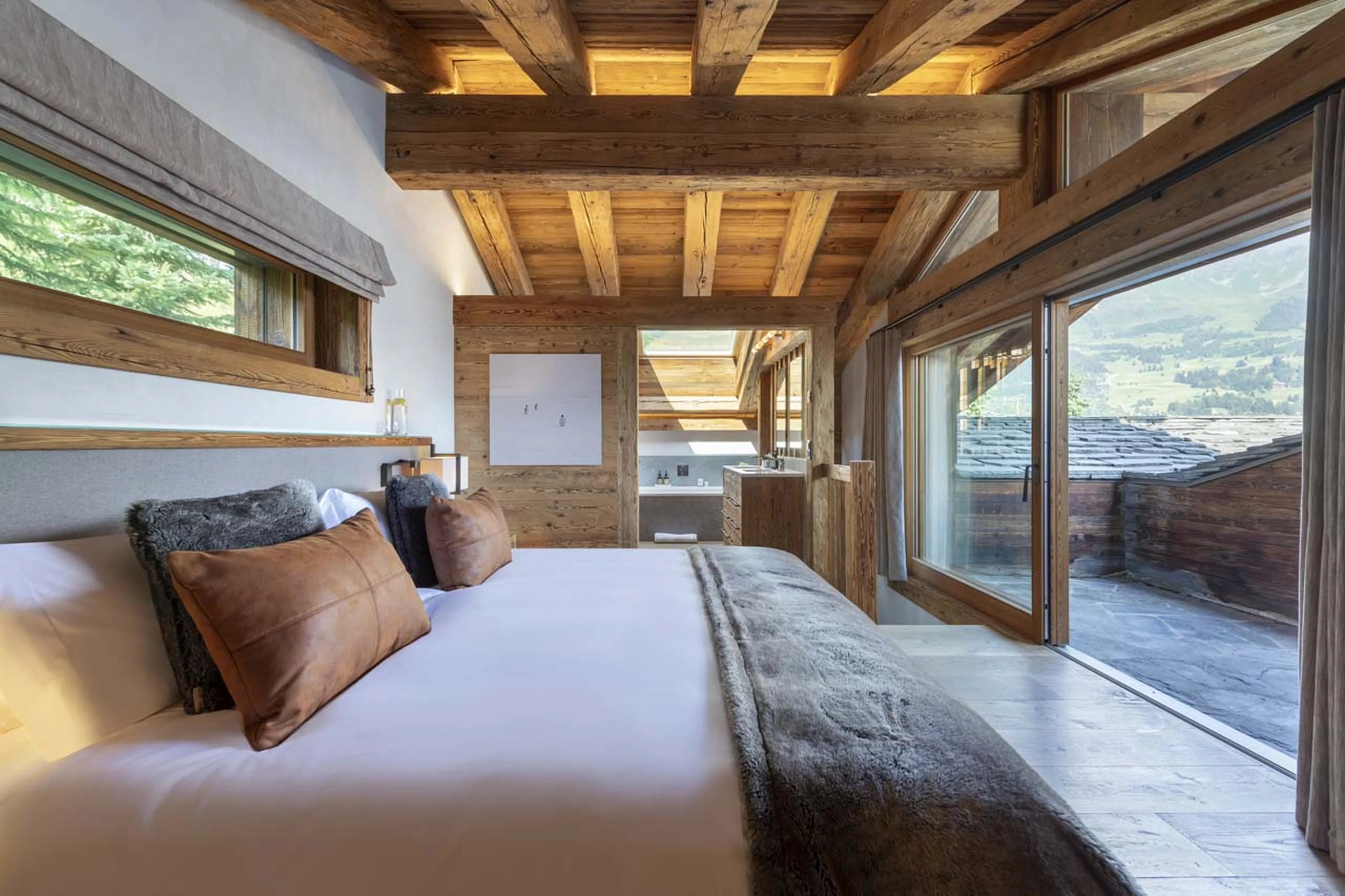 Double bed in master bedroom of Chalet Le Vigne in Verbier