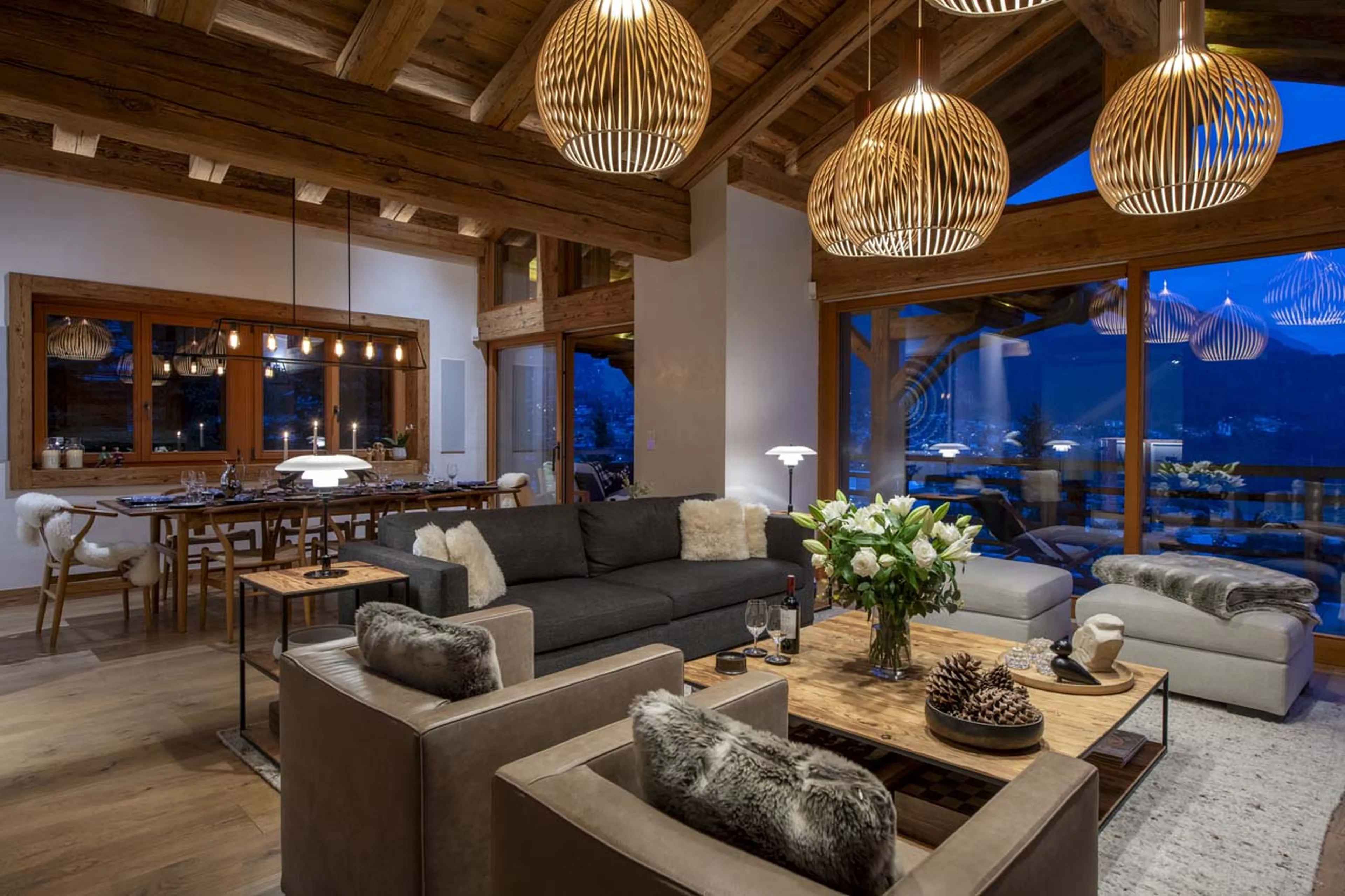 Comfortable sofas in open plan living area at Chalet La Vigne in Verbier