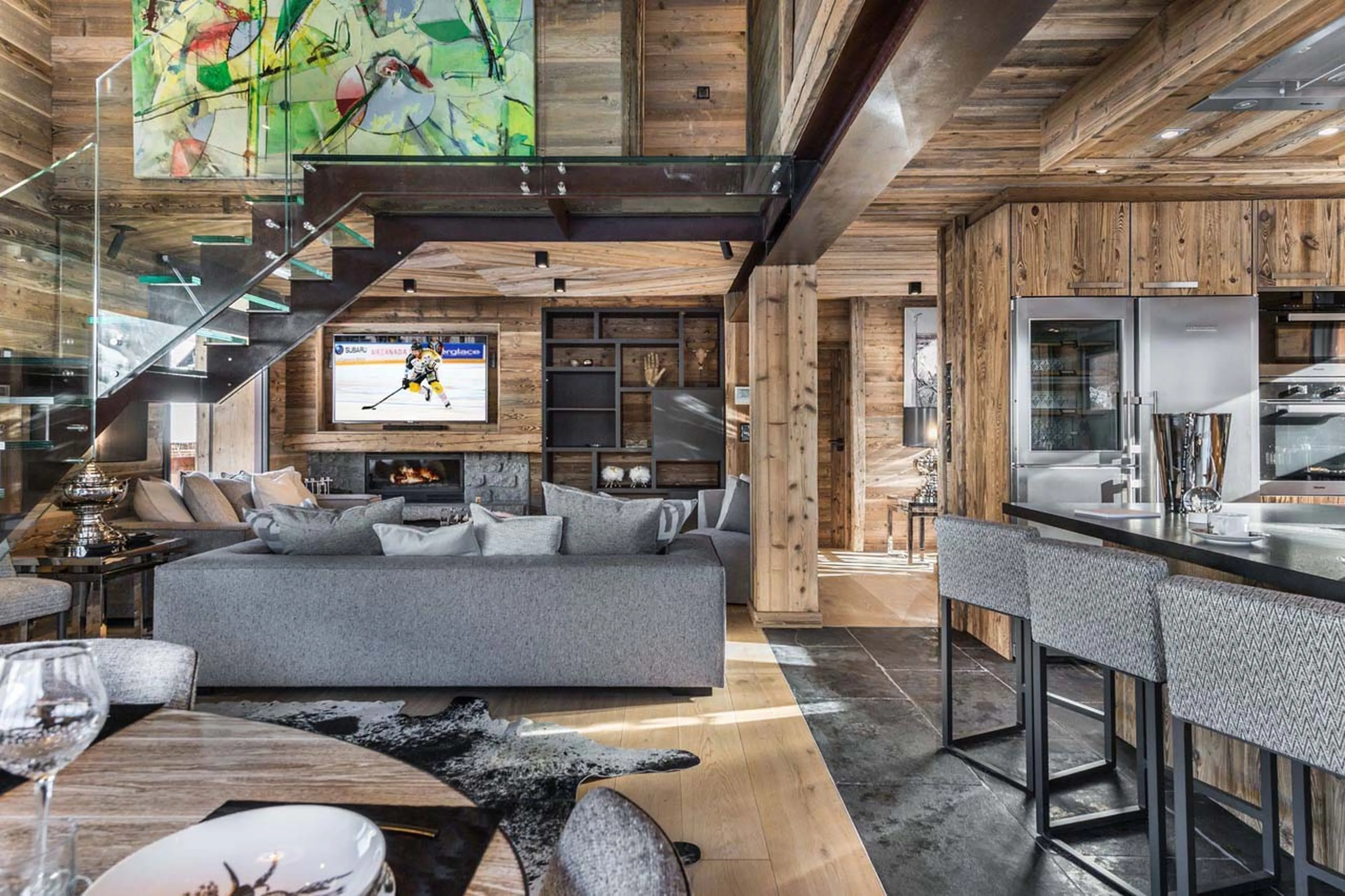 TV & fireplace in living area at Chalet Lamartine in Megeve