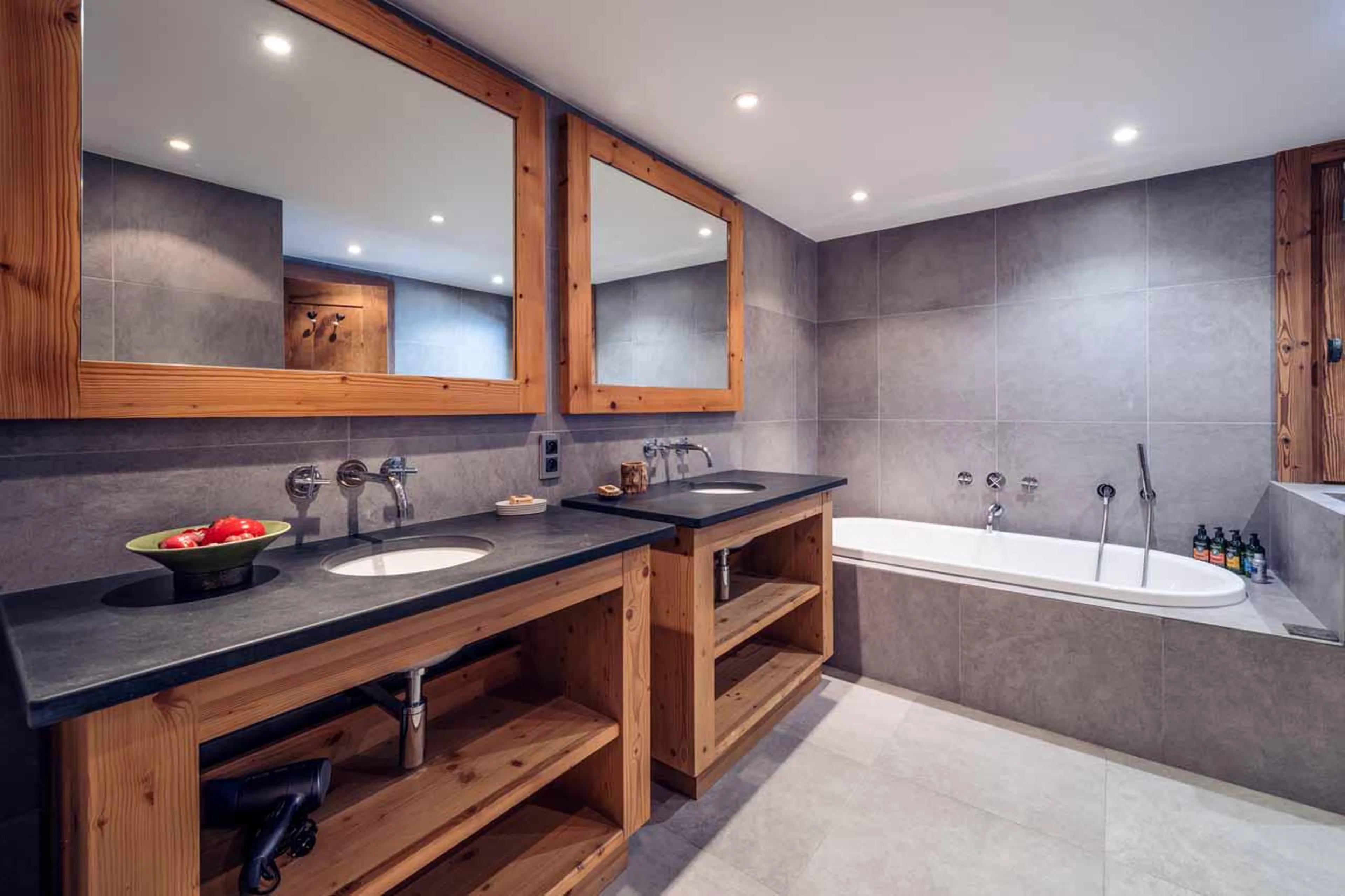 En-suite bathroom with hand shower over bath at Chalet Lapin Blanc in Meribel
