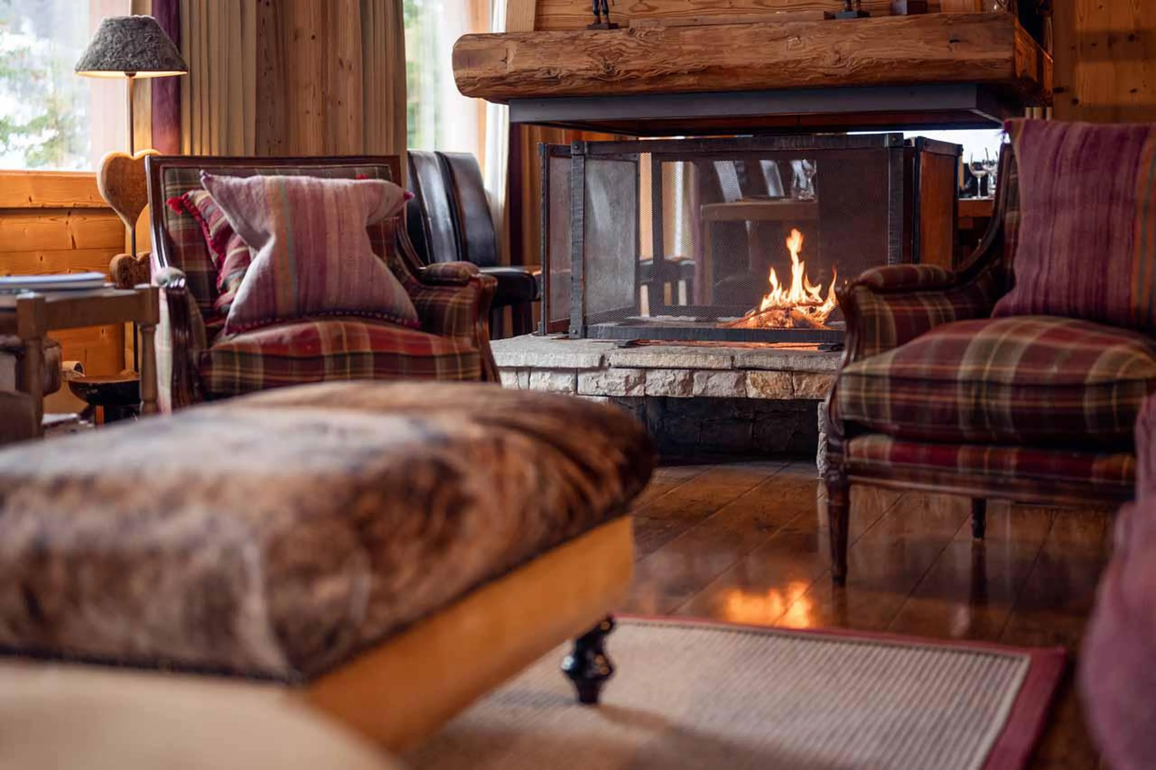 Wood-burning fireplace providing a warm and homely feel at Chalet Lapin Blanc in Meribel