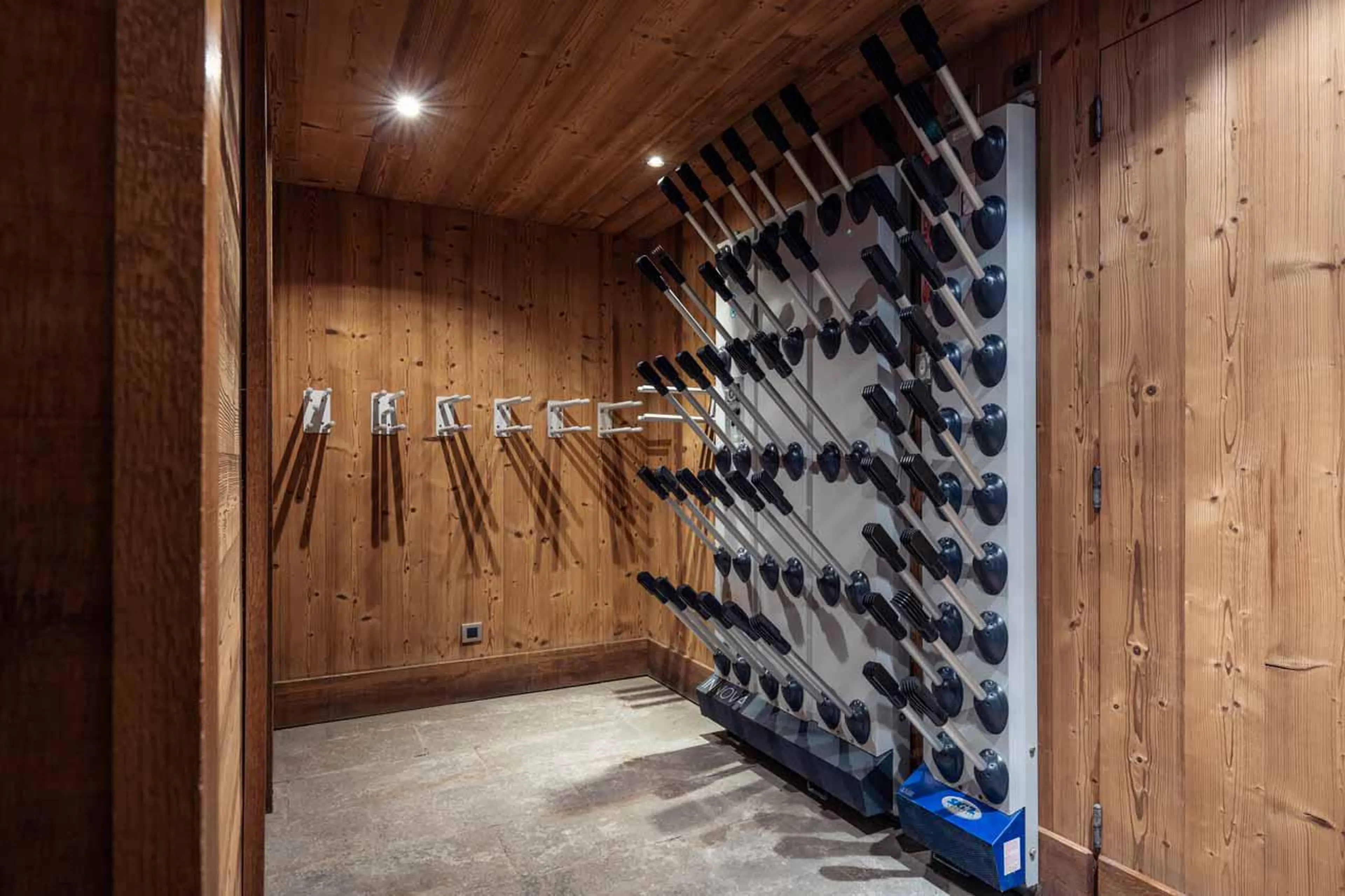 Ski and boot room with heated boot racks and glove warmers at Chalet Lapin Blanc in Meribel