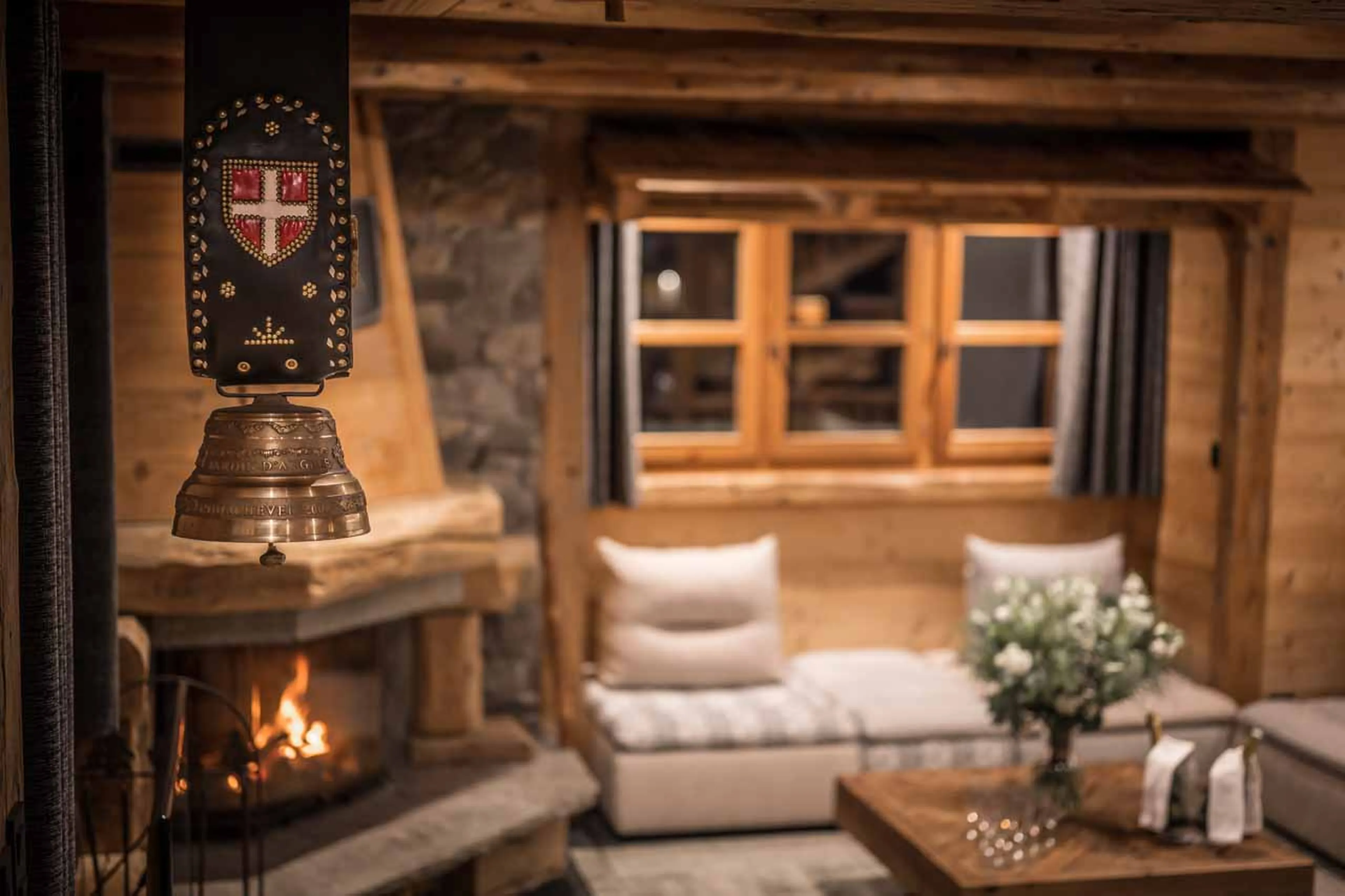 Wood-burning fireplace at Chalet Le 1946 in Courchevel Le Praz
