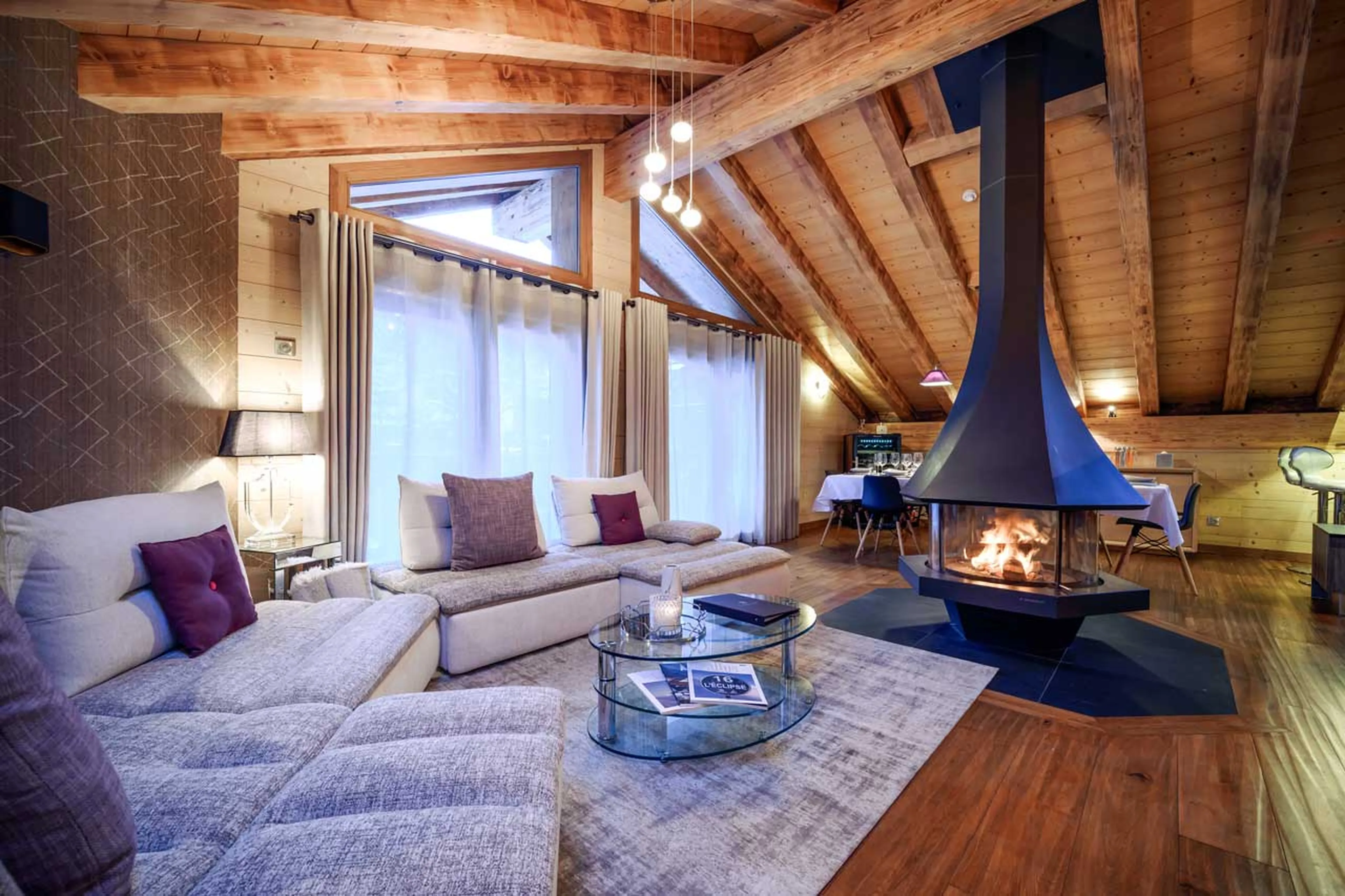 Suspended wood-burning fireplace and access to balconyat Chalet Le 1992 in Courchevel Le Praz
