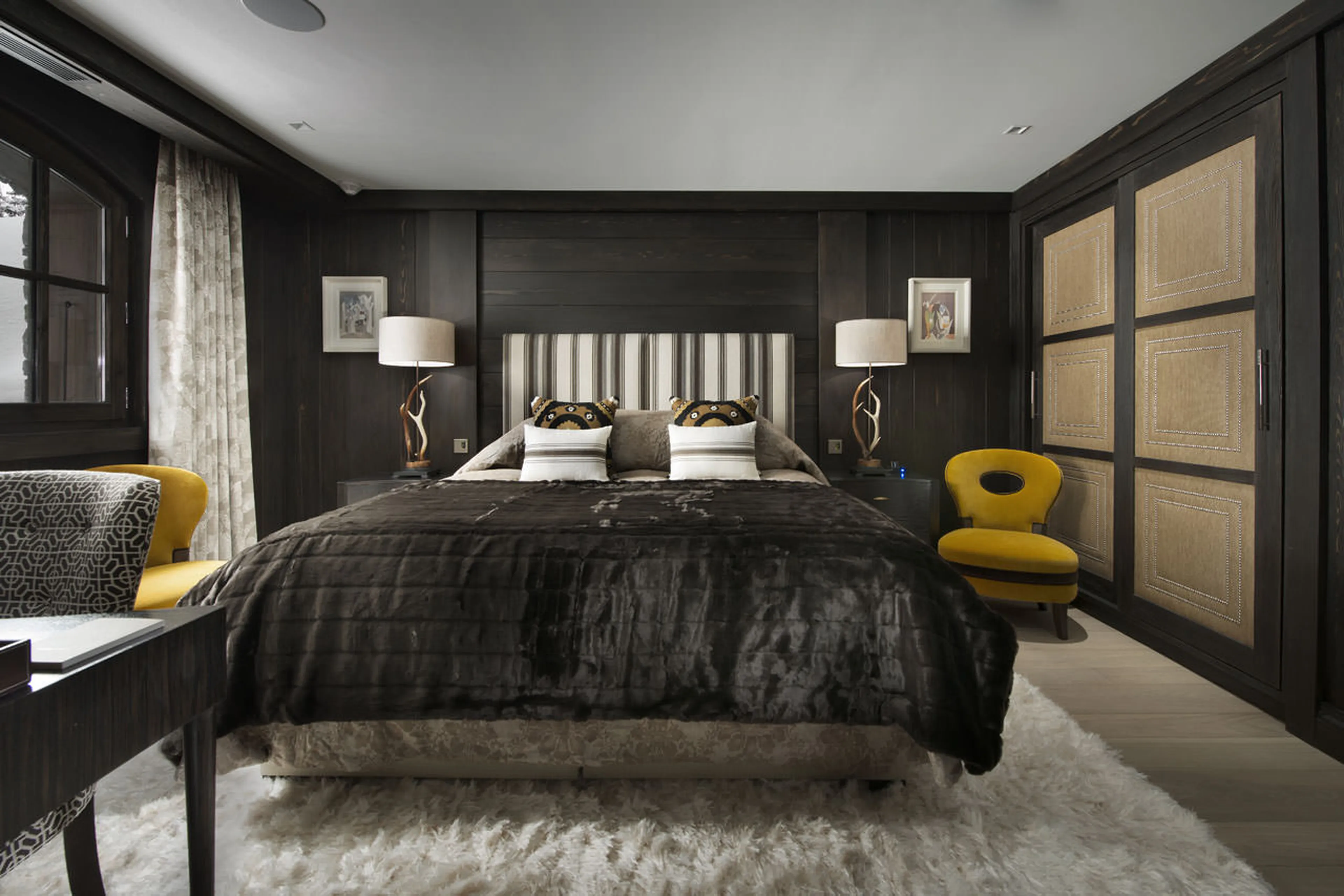 Double bed in sixth bedroom of Chalet Le Coquelicot in Courchevel 1850