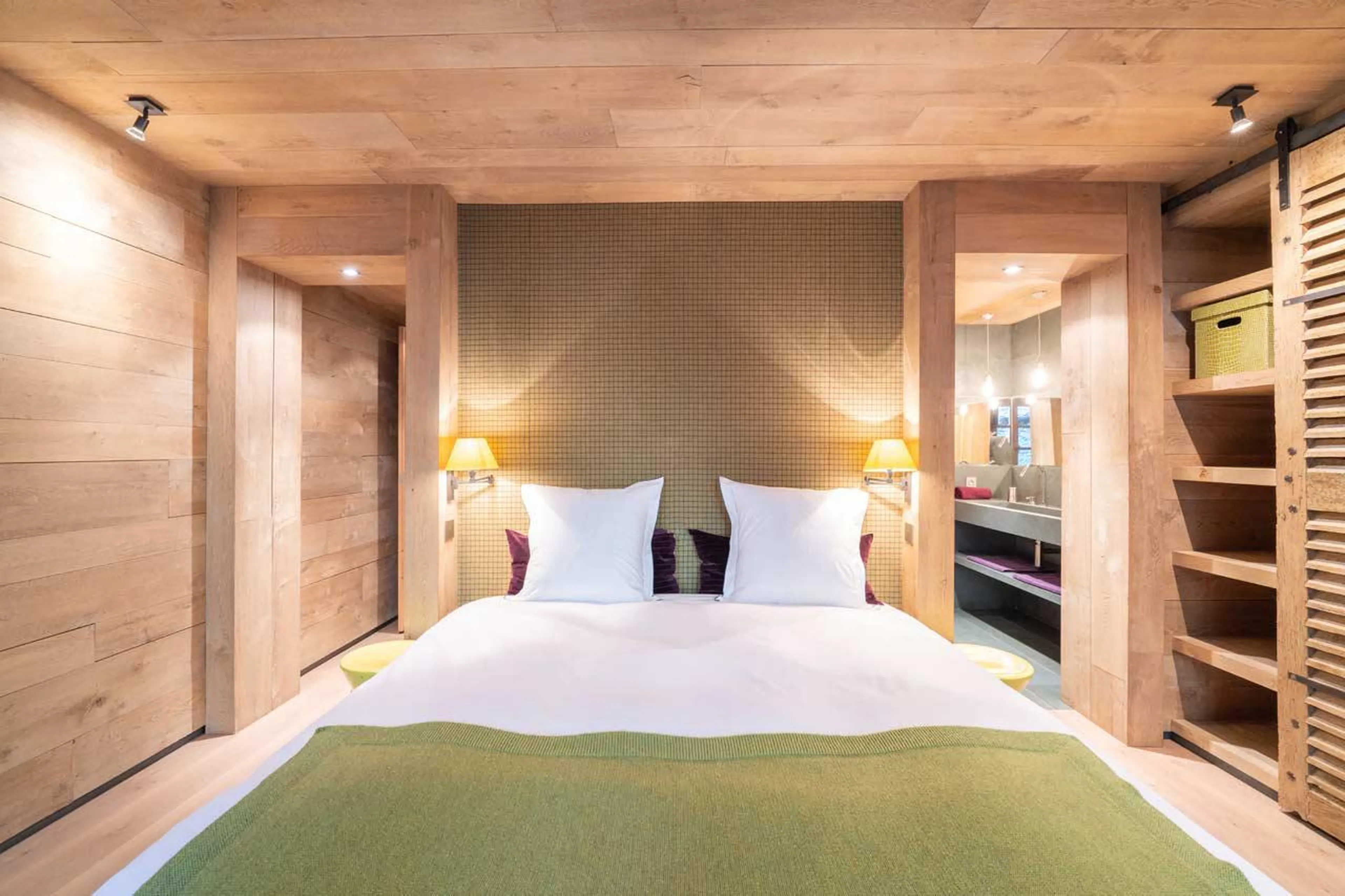 Bedroom with generous storage space and en-suite bathroom at Le Grand Cerf in Meribel
