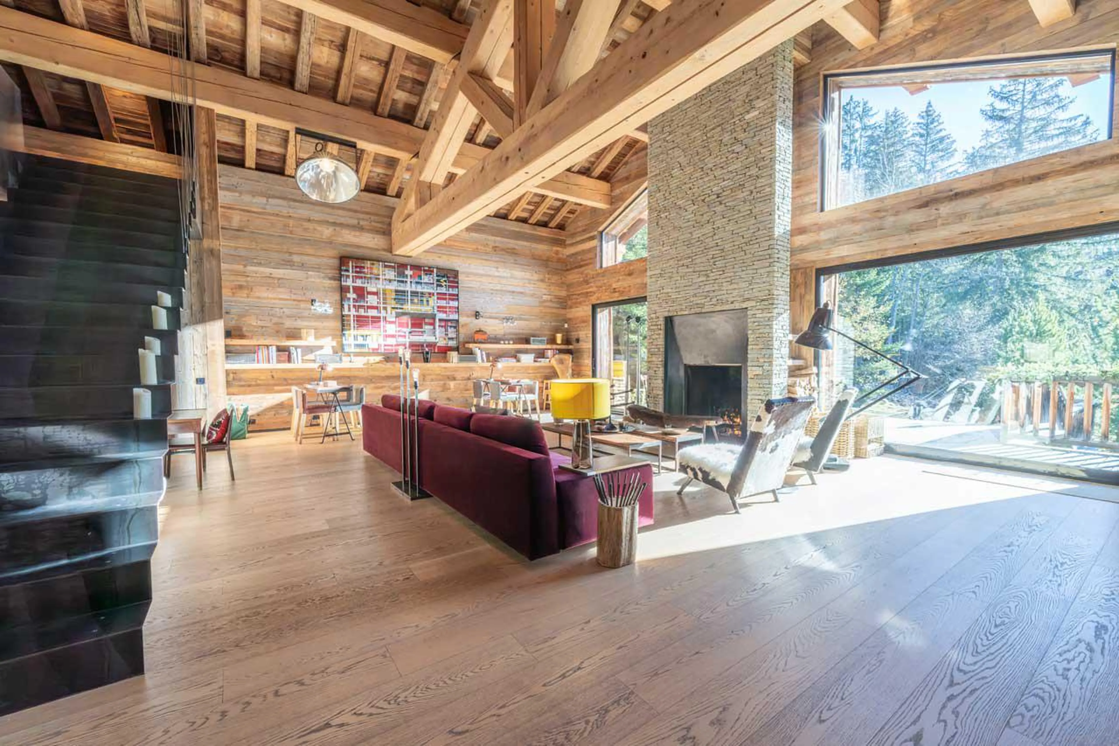 Fireplace and access to terrace at Chalet Grand Cerf in Meribel