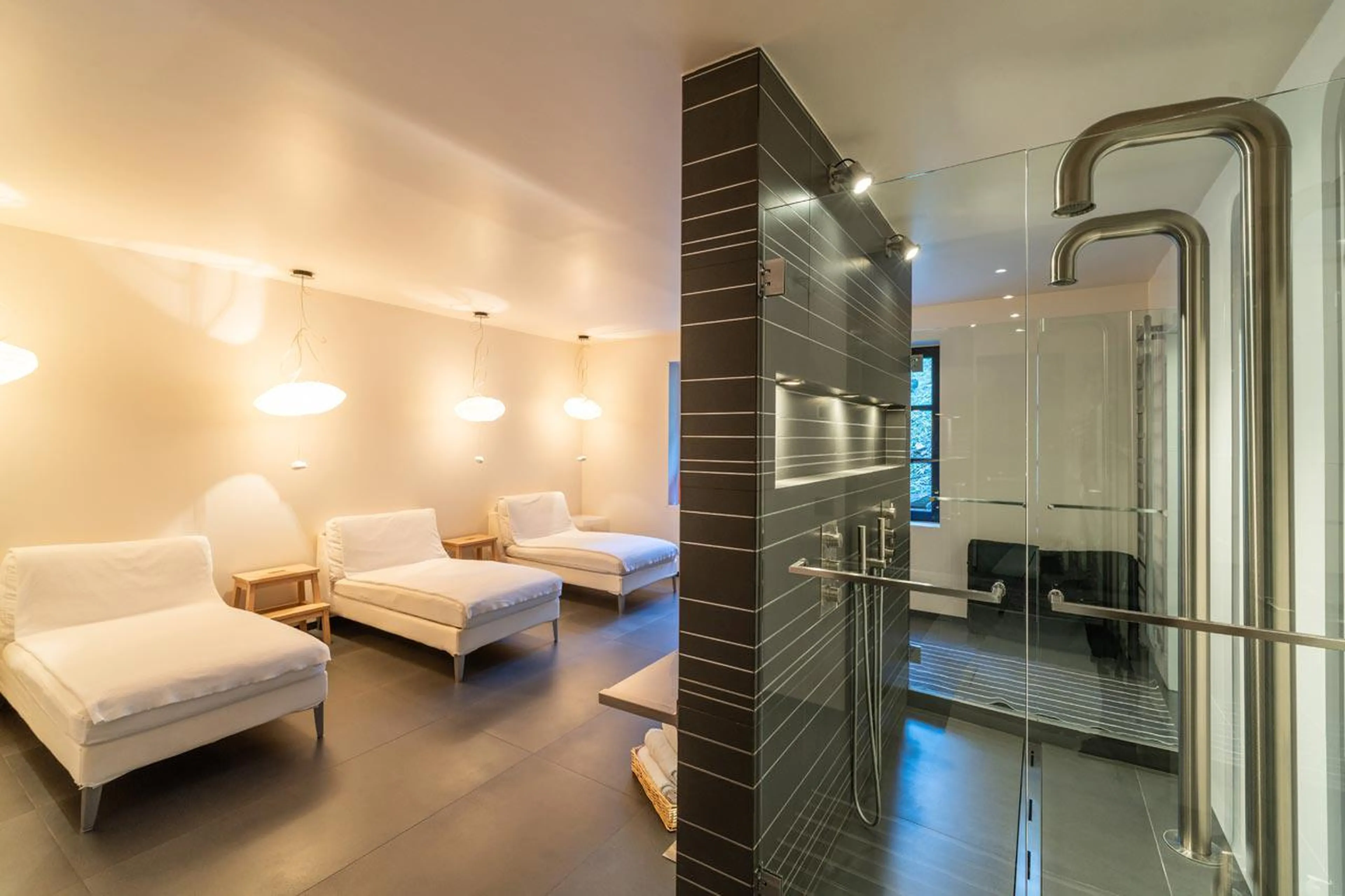 Spa with showers and chase loungers at Le Grand Cerf in Meribel