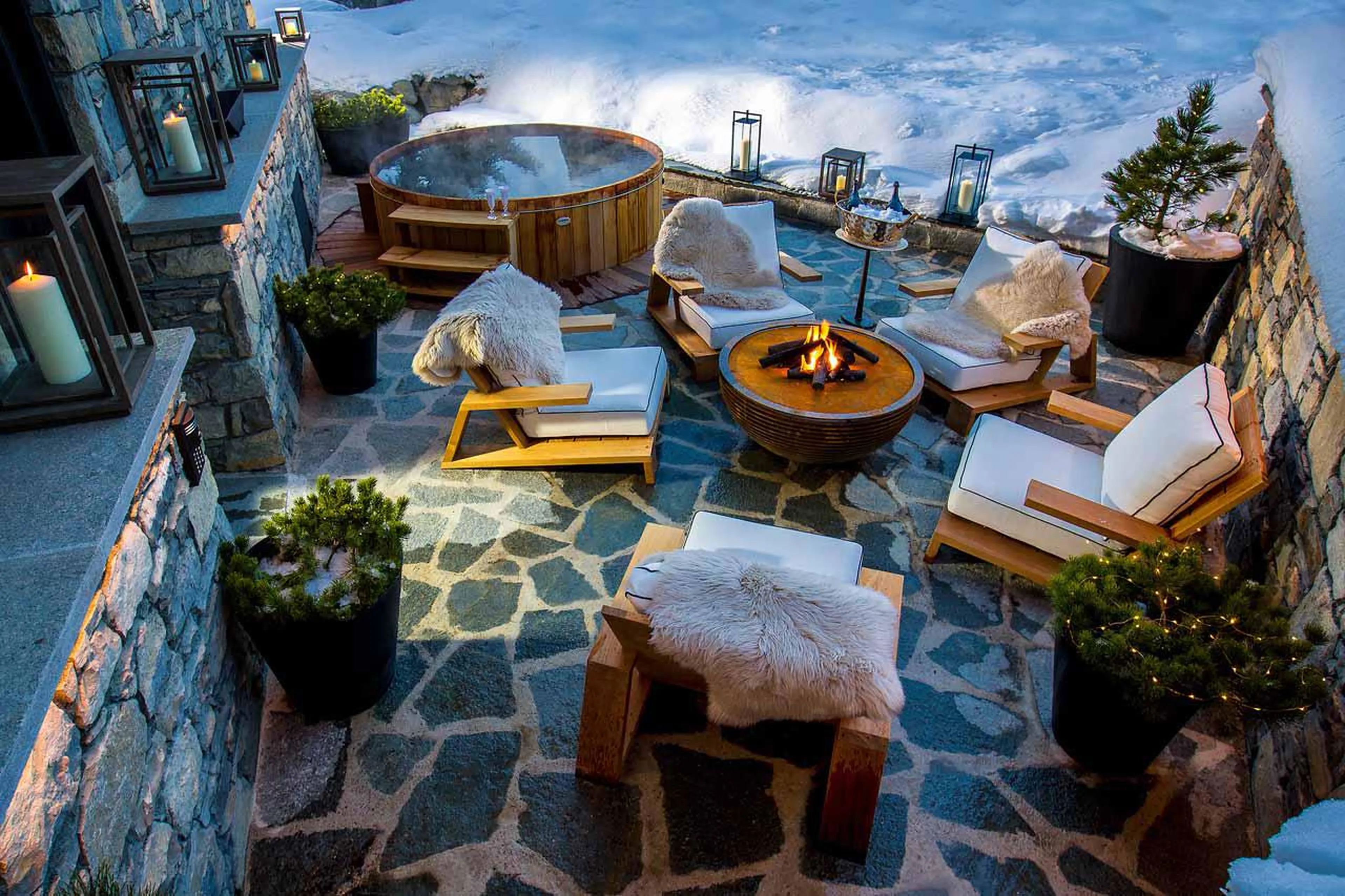 Hot tub and outdoor seating area at Chalet Le Kismet, Courchevel 1850