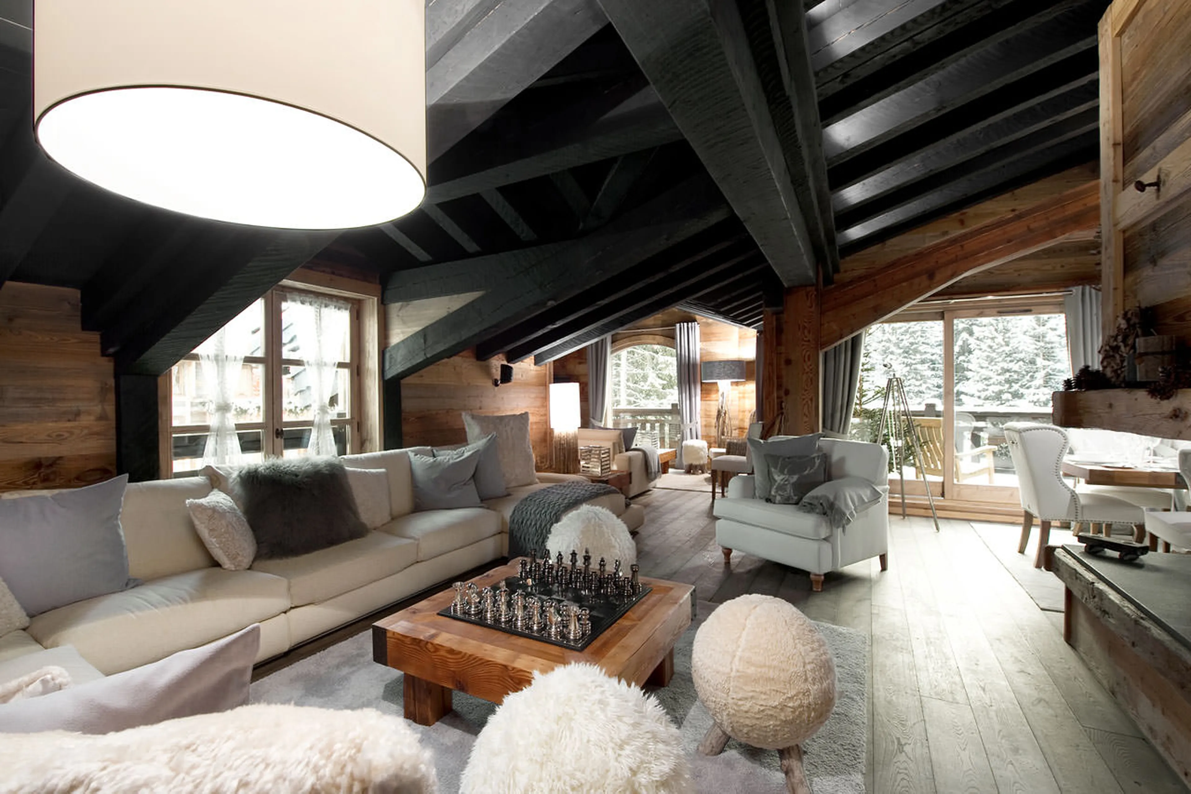 Graceful living area under the vaulted ceiling of Chalet Le Petit Chateau in Courchevel 1850