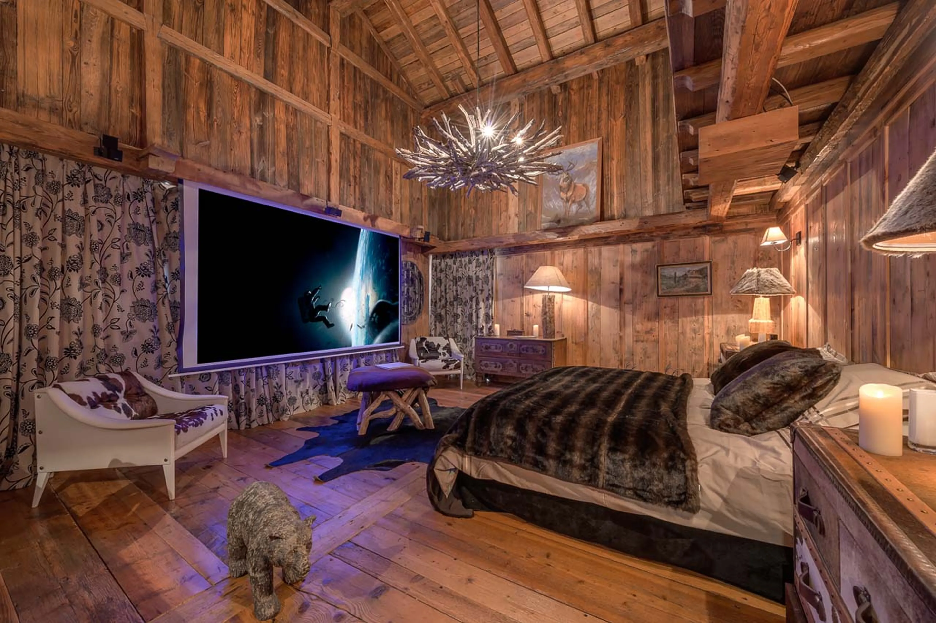Home cinema system in master bedroom of Chalet Le Rocher in Val d’Isere