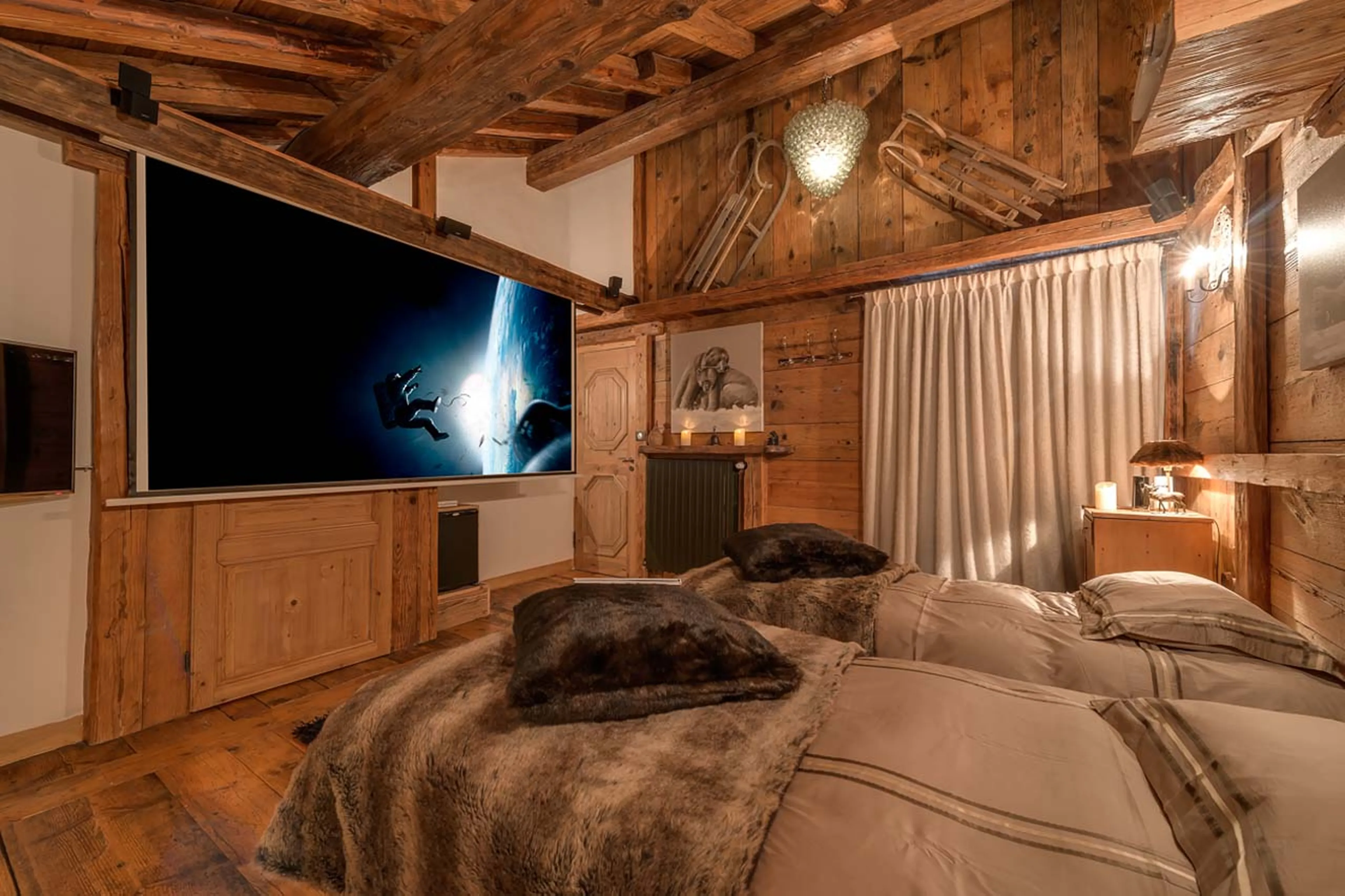 Home cinema system in double/twin bedroom of Chalet Le Rocher in Val d’Isere