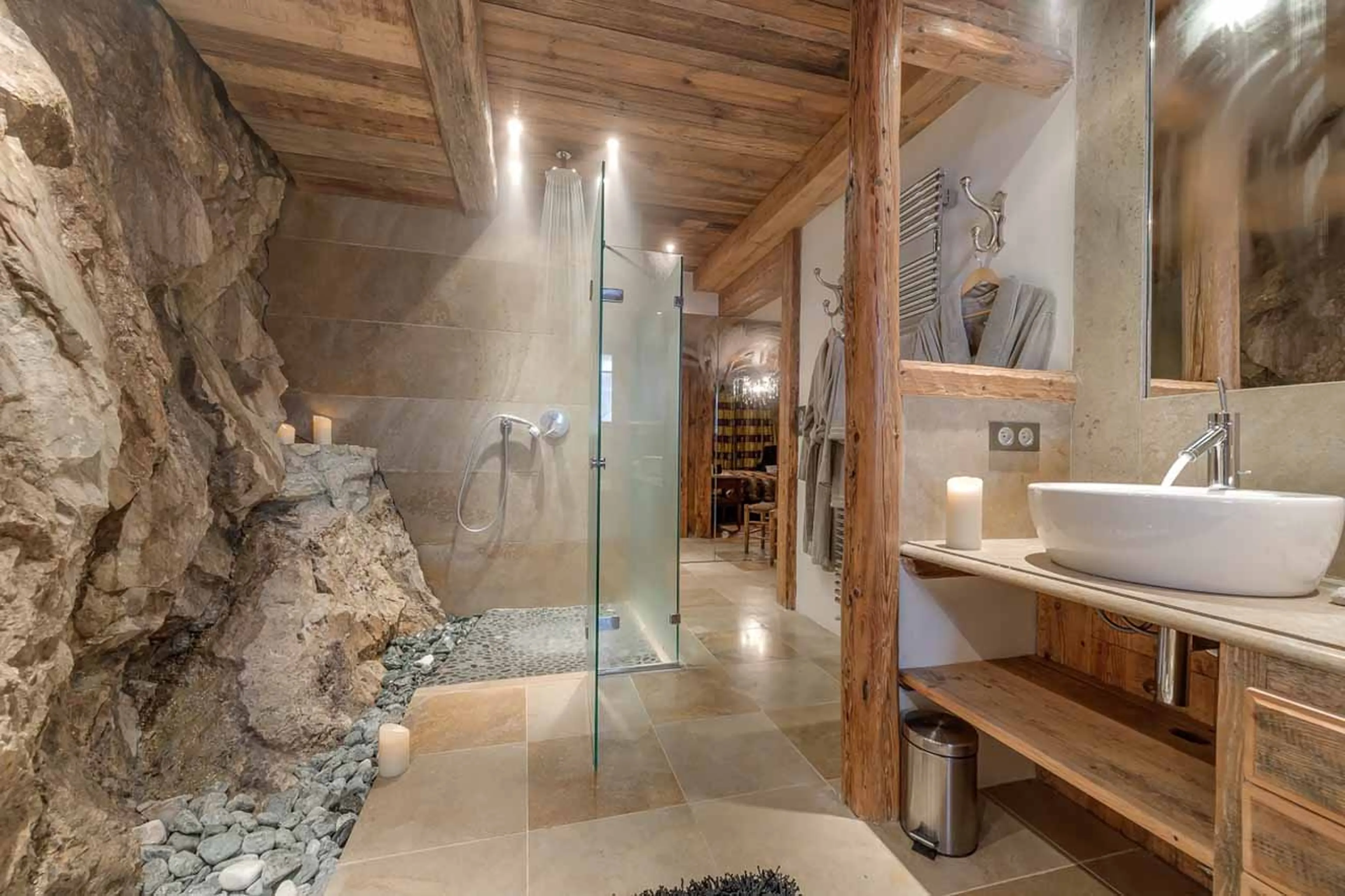 Bedroom 3 ensuite with exposed rock at Le Rocher, Hameau Alpin in Val d'Isere