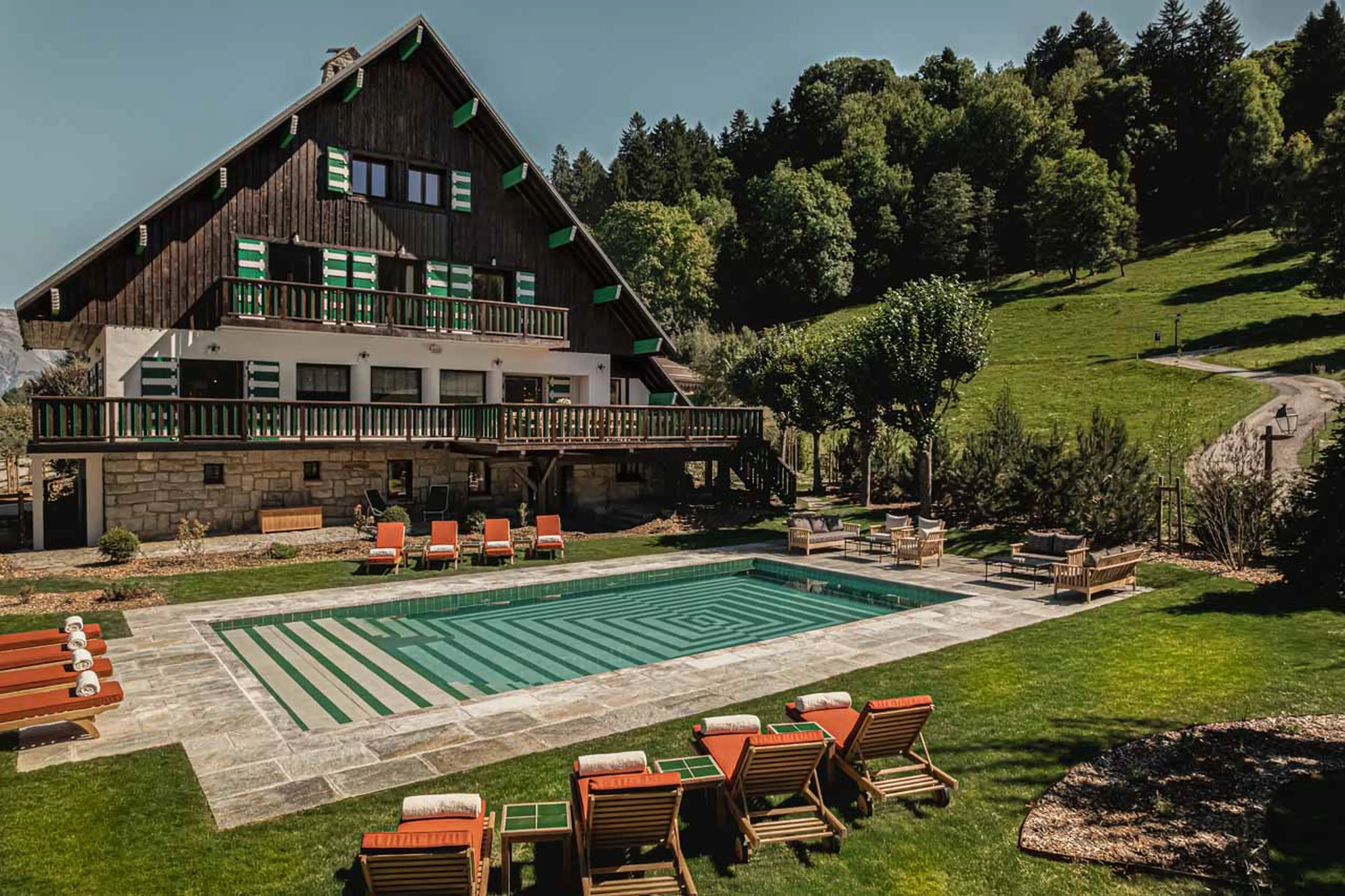 Exterior including swimming pool at Chalet Le Sarto in Megeve