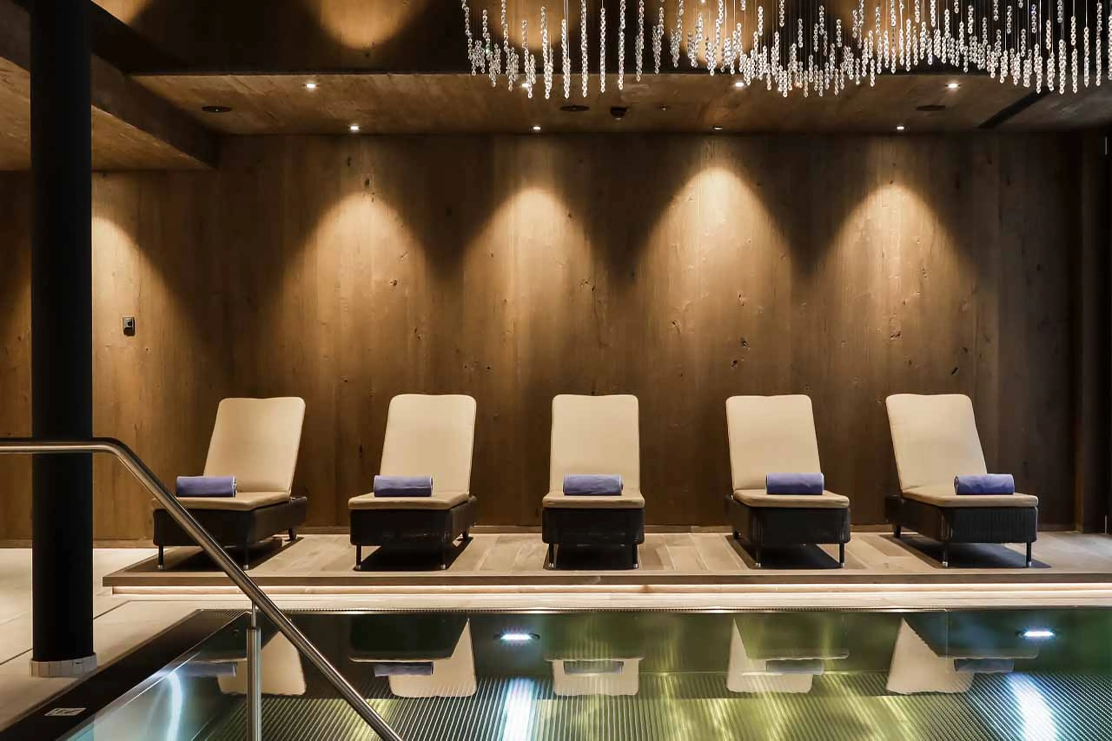 Loungers beside pool at Chalet Lena in St Anton