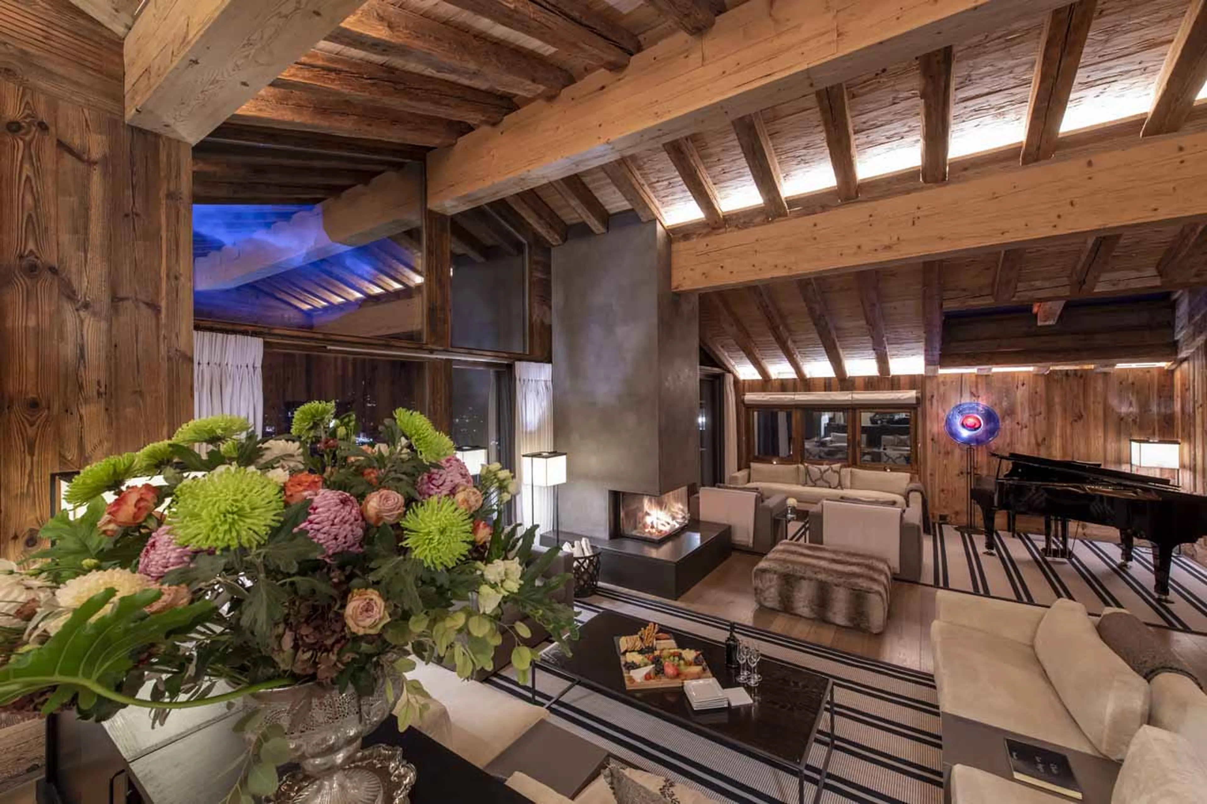 Fireplace in living room of Chalet Les Anges in Zermatt