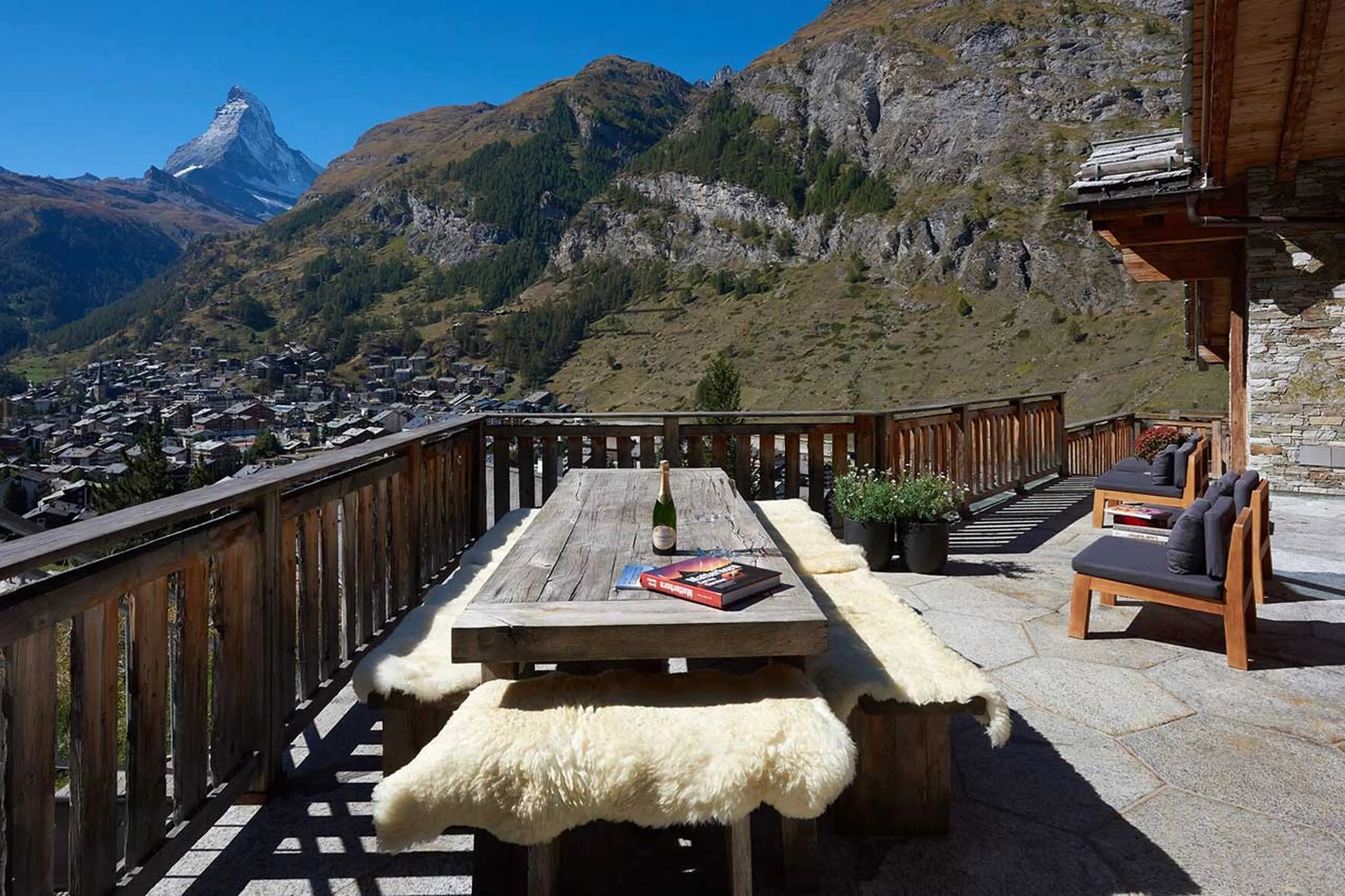 Al fresco dining on terrace at Chalet Les Anges in Zermatt