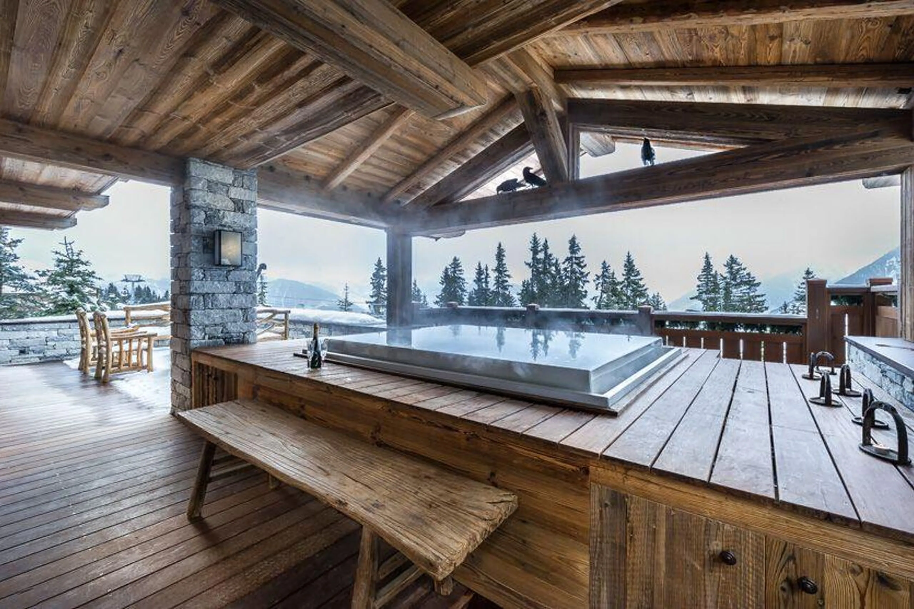 Jacuzzi on the large outdoor terrace of Chalet Les Bastidons  in Courchevel 1850