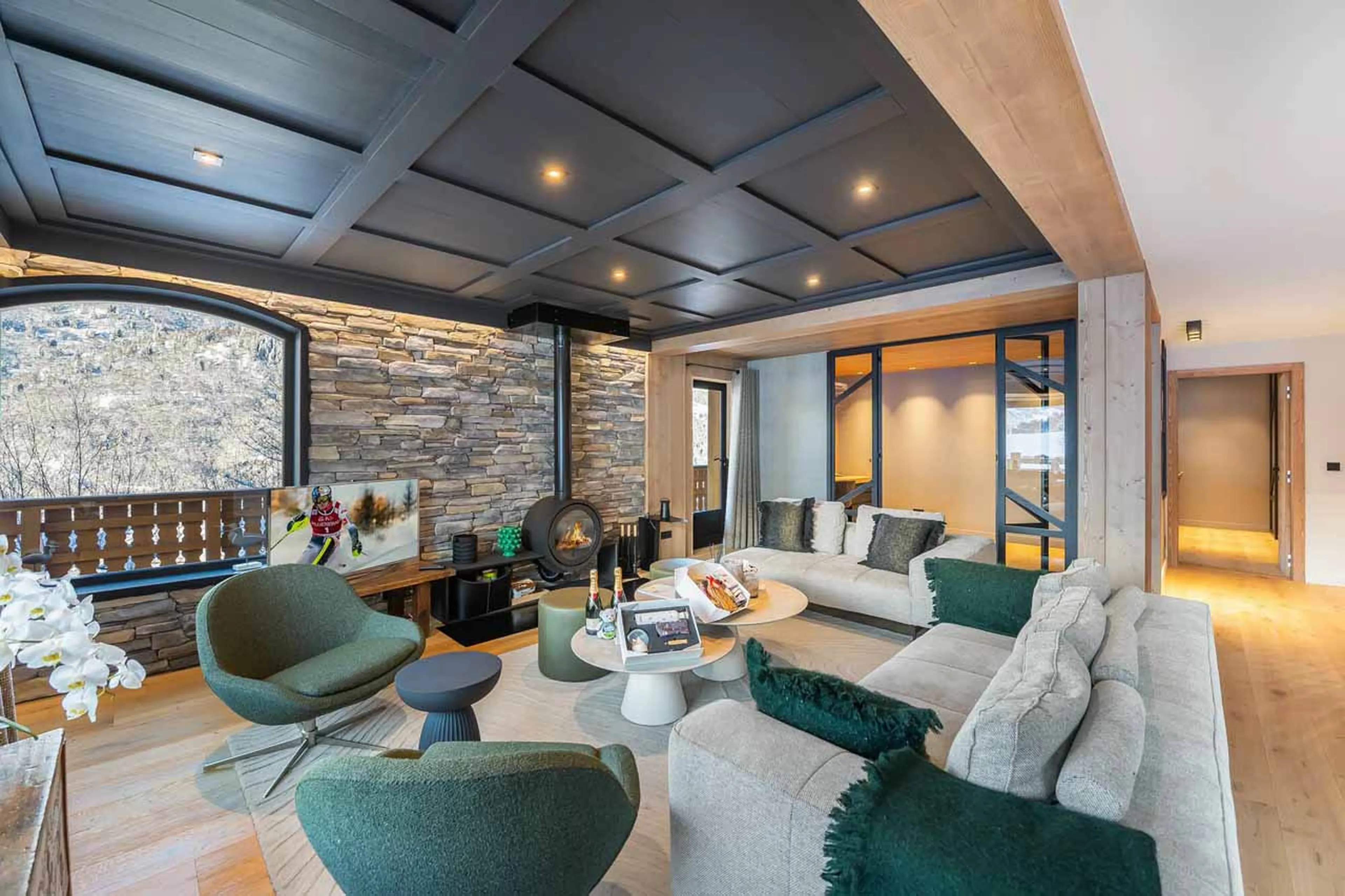 Living room with fireplace at Chalet Les Morilles in Meribel