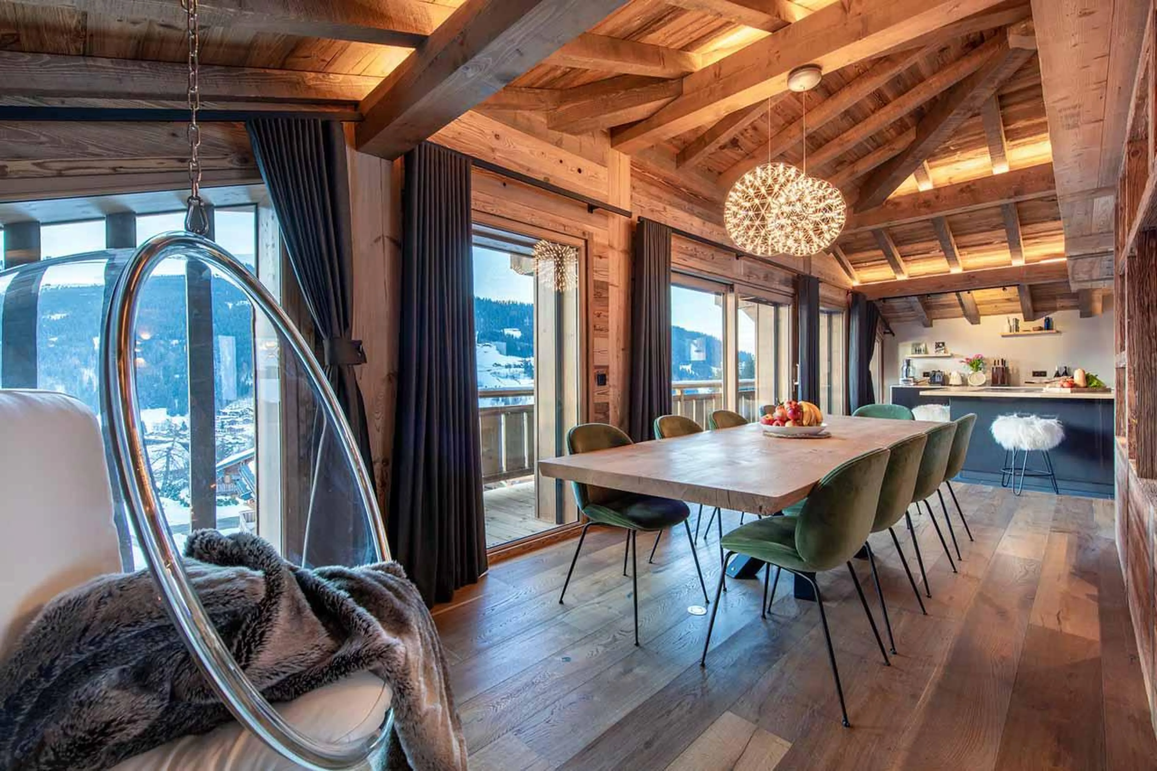 Dining area and swing chair at Chalet les Sapins in Les Gets