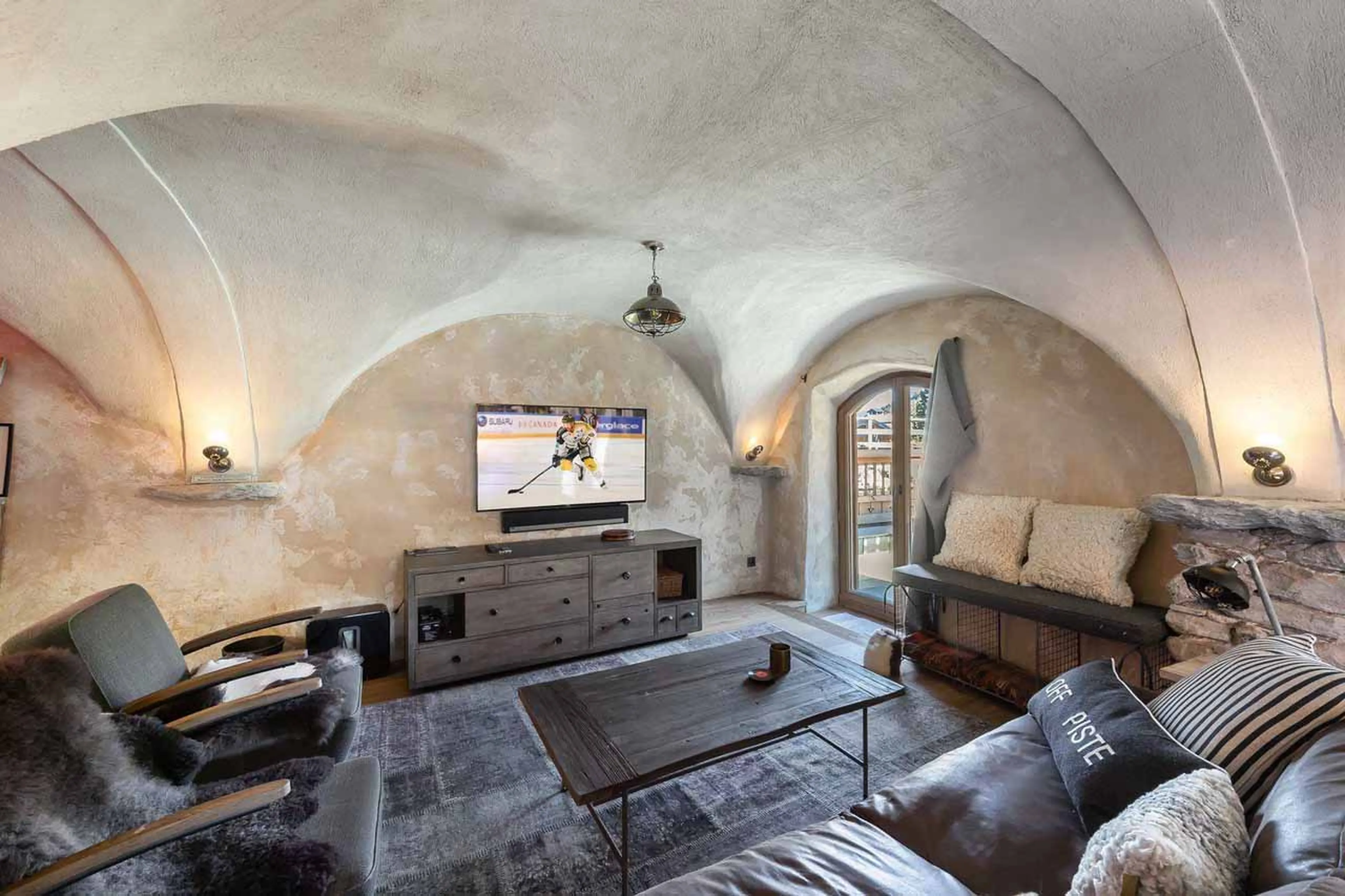 TV lounge with sofas at Chalet Les Voutes in Meribel