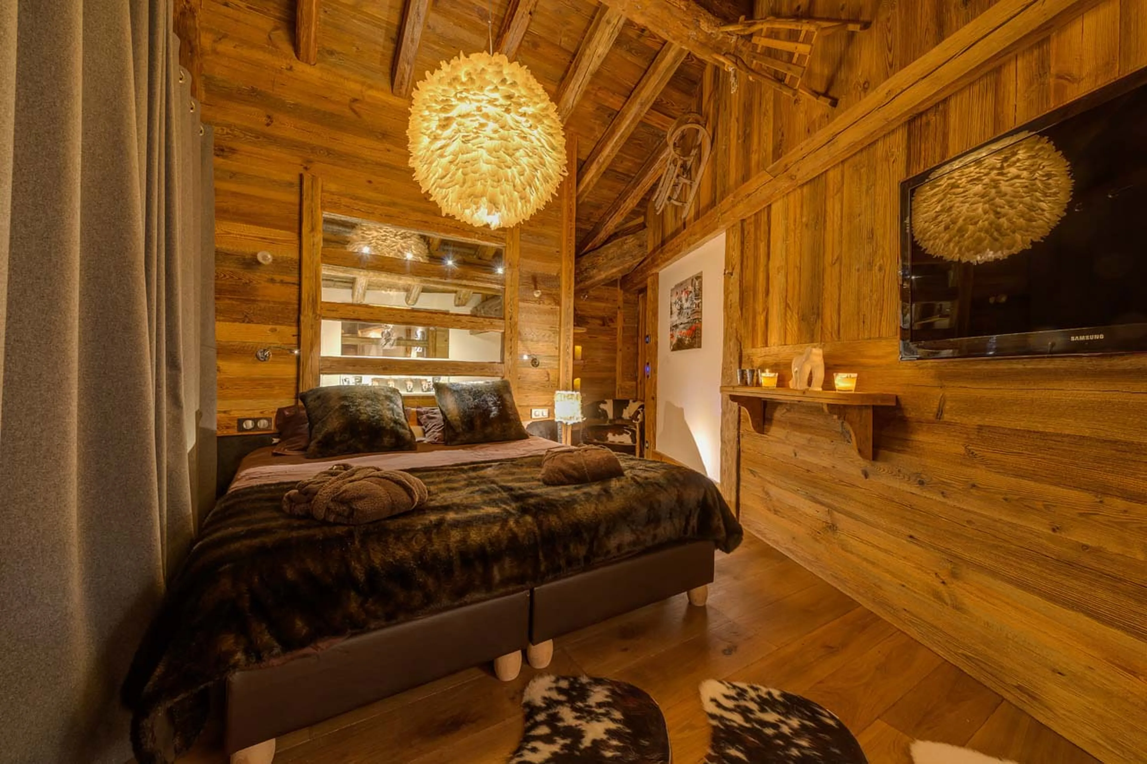 Lavish double bedroom with en suite bathroom and balcony access in Chalet Lhotse in Val d’ Isere