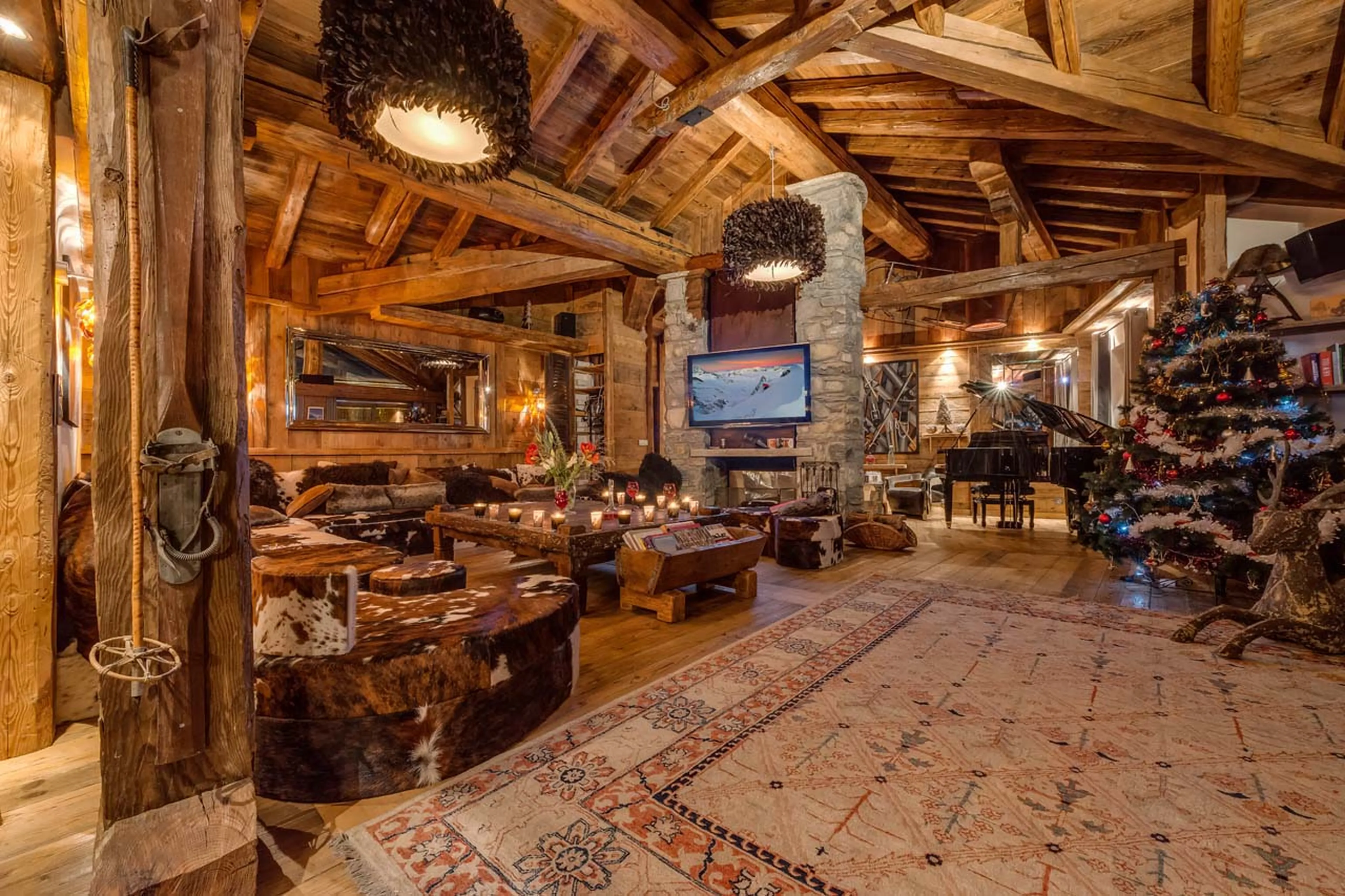 Wooden walls, floors and massive wood beams welcome you in Chalet Lhotse in Val d’ Isere