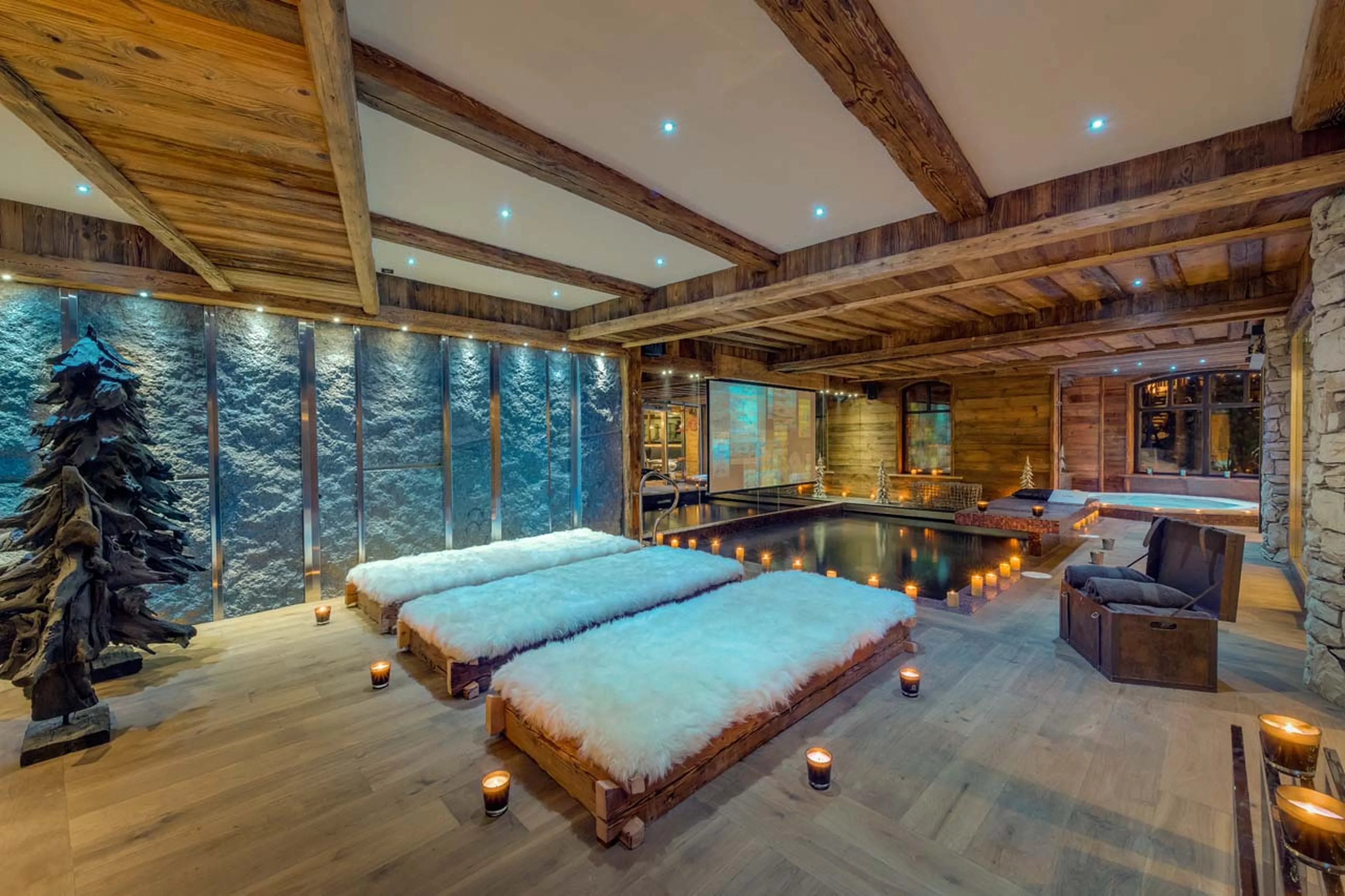 Indoor heated swimming pool with drop down cinema screen in Chalet Lhotse in Val d’ Isere