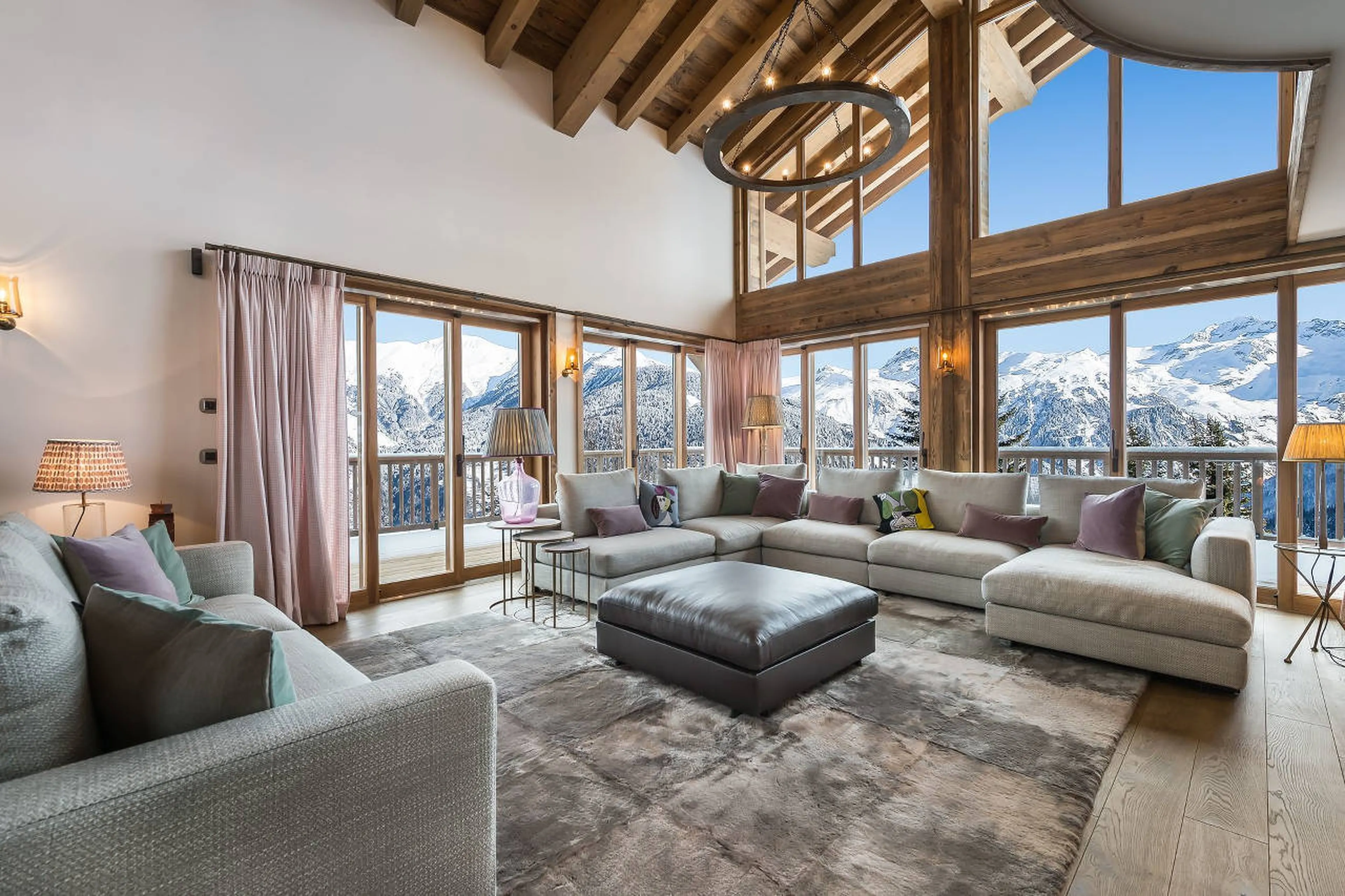 Open-plan lounge area with floor to ceiling windows in Chalet Libellule in Courchevel 1650