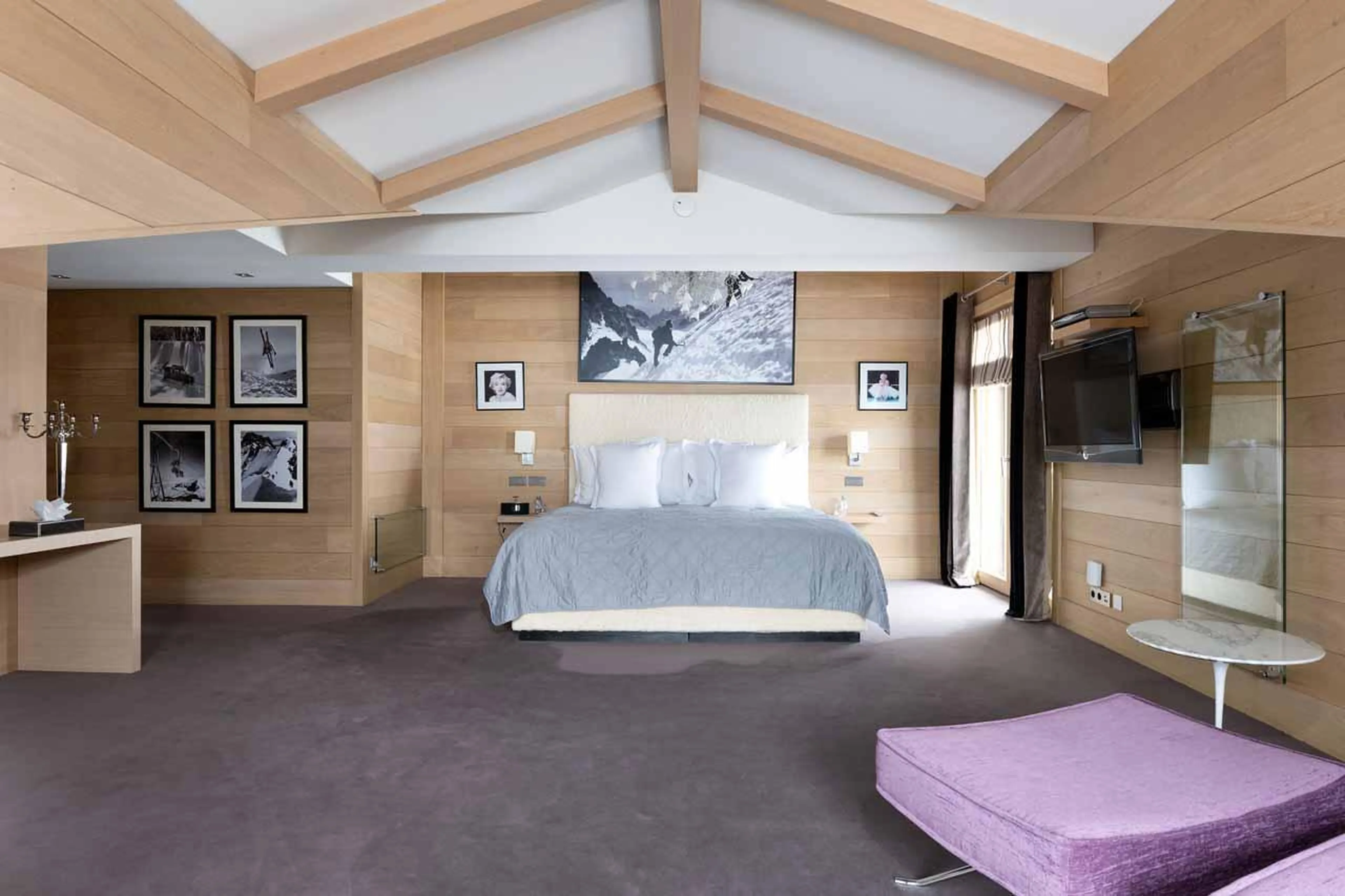 En suite master bedroom with balcony access and office in Chalet Licorne in Courchevel 1650