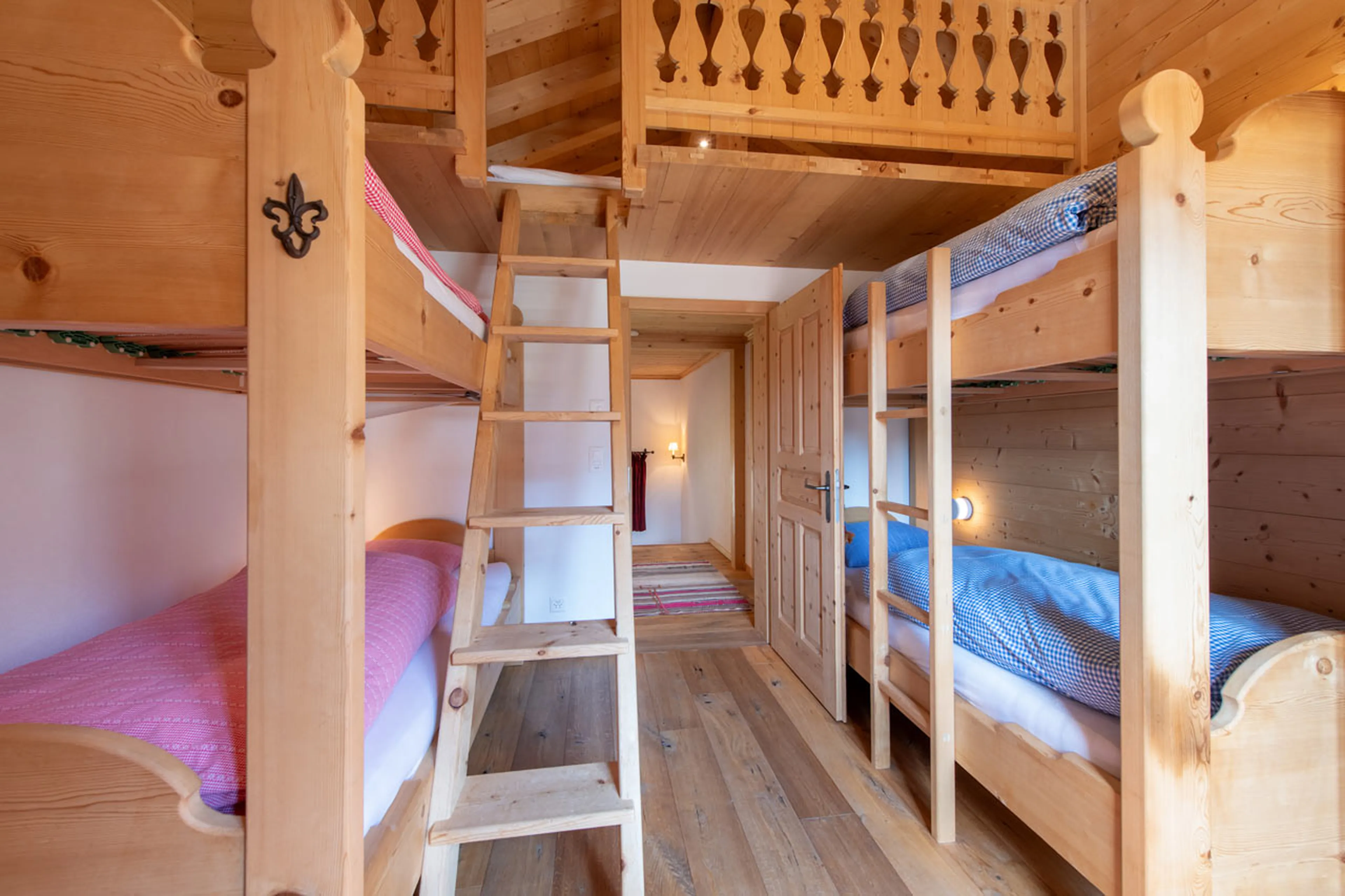 Bunk bedroom with space for two on mezzanine level in Chalet Luegisland in Klosters