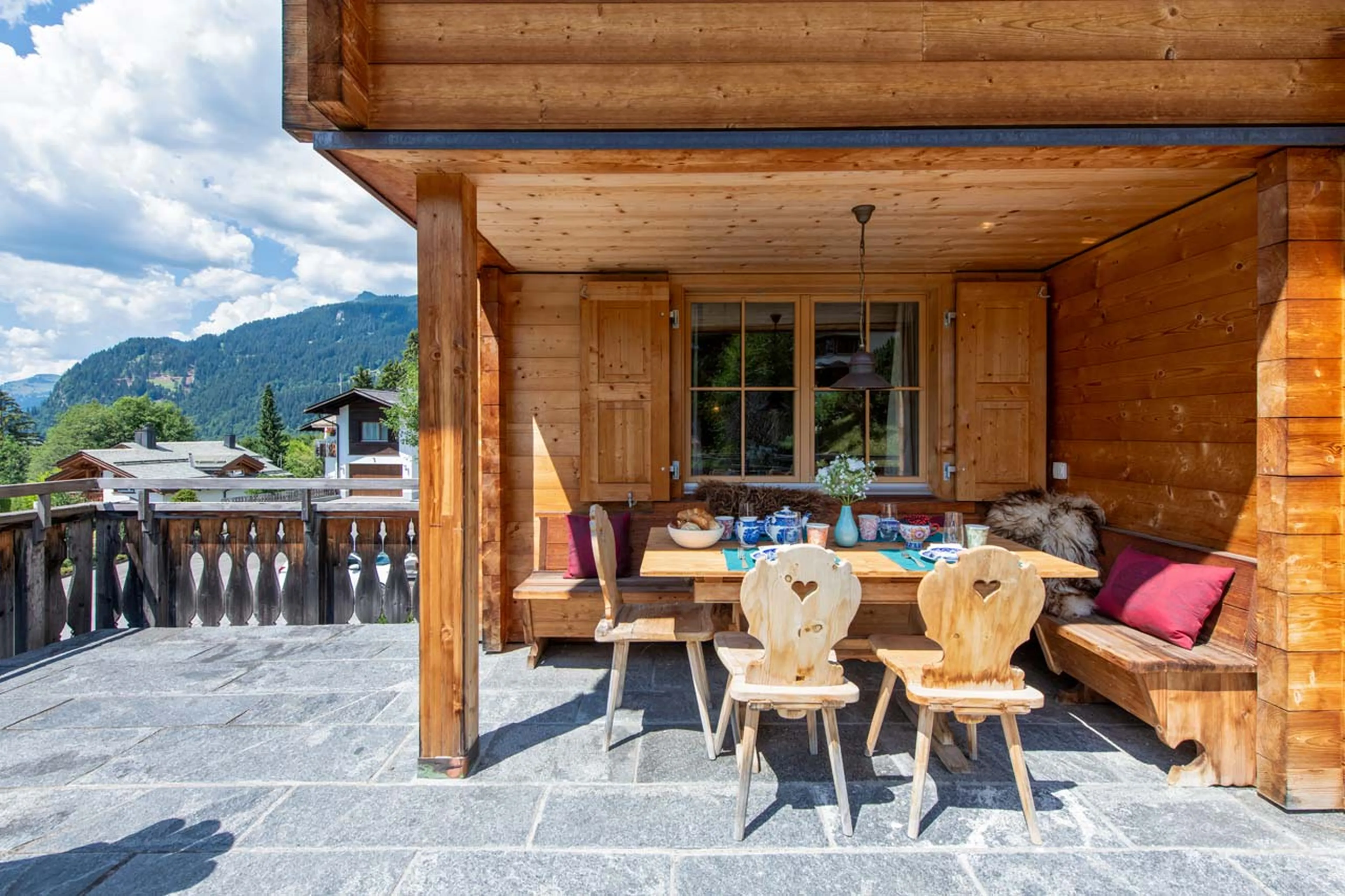 Terrace with a view and alfresco dining corner, Chalet Luegisland in Klosters