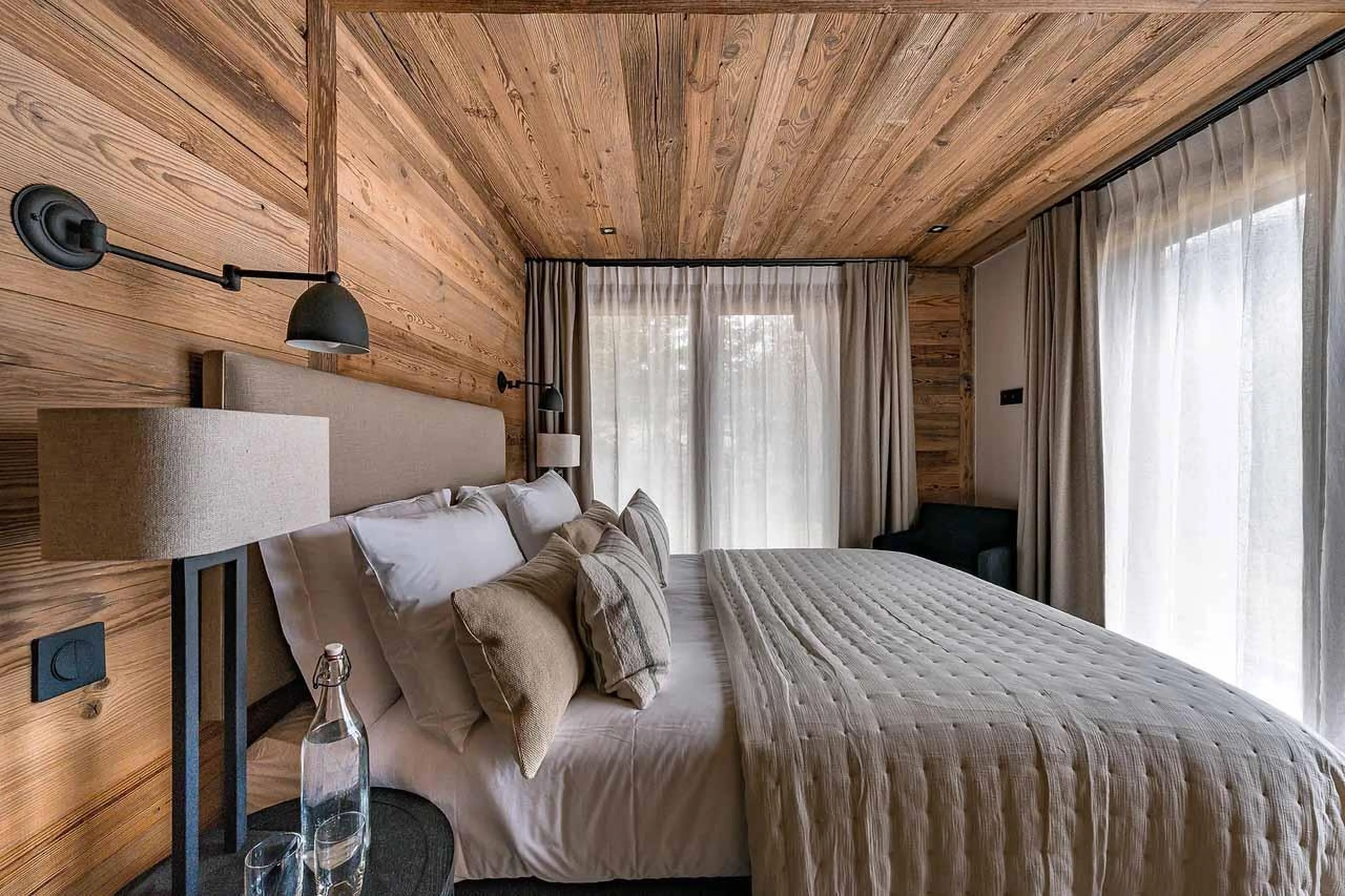 Double bedroom with sliding glass doors in Chalet Lupa, Chamonix