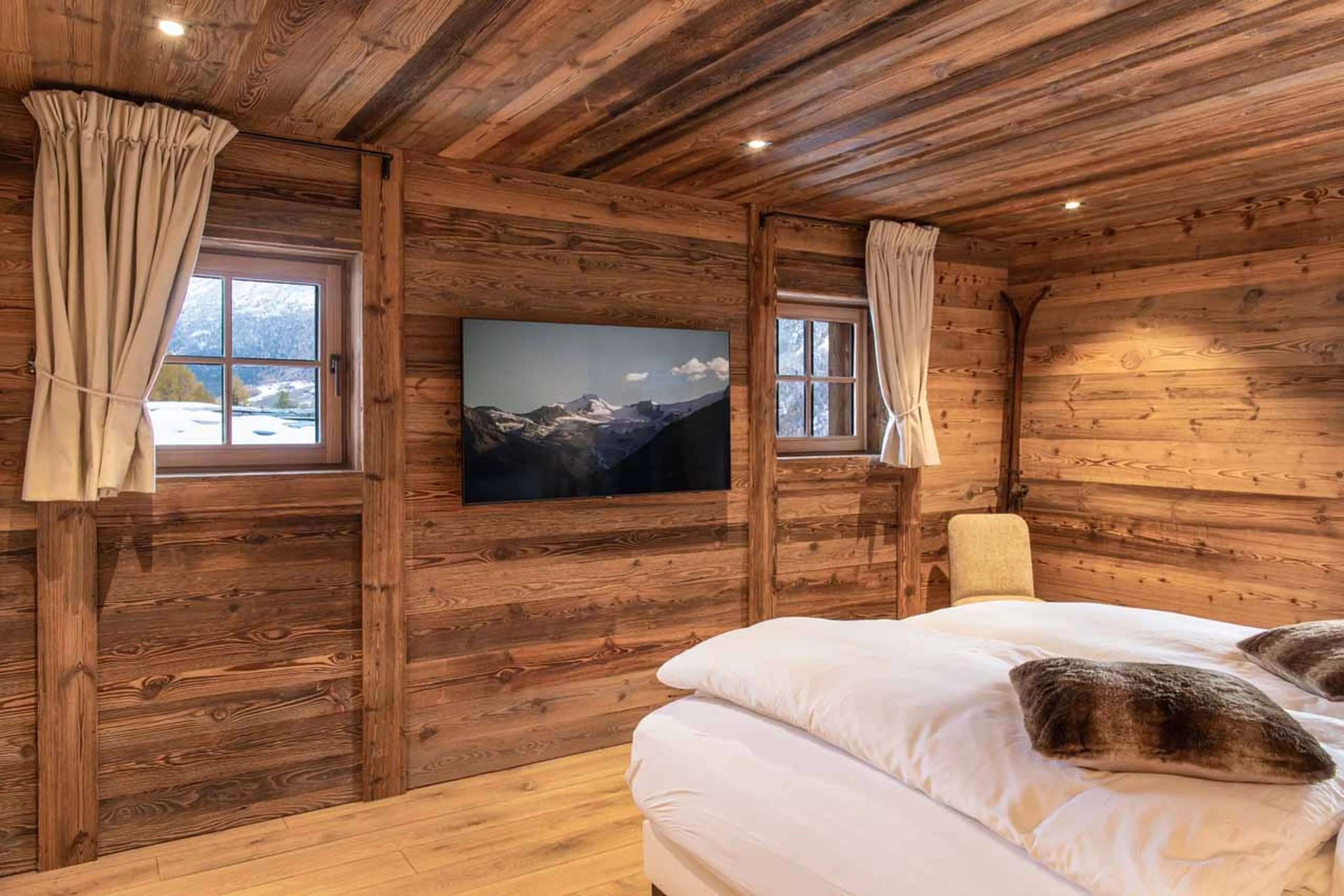 TV in bedroom suite at Chalet Lycka in Saas Fee