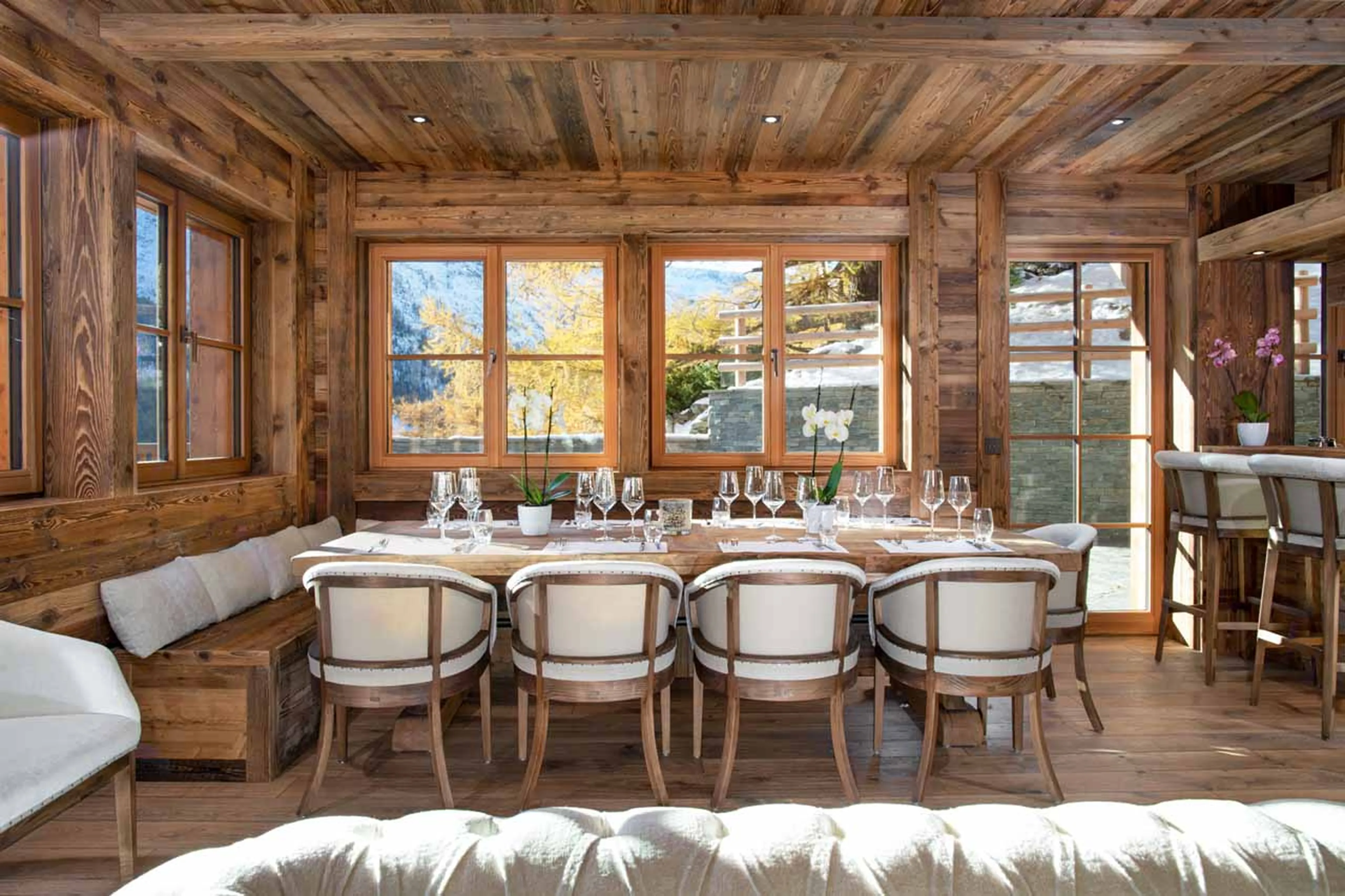 Dining area opening onto terrace at Chalet Lycka in Saas Fee