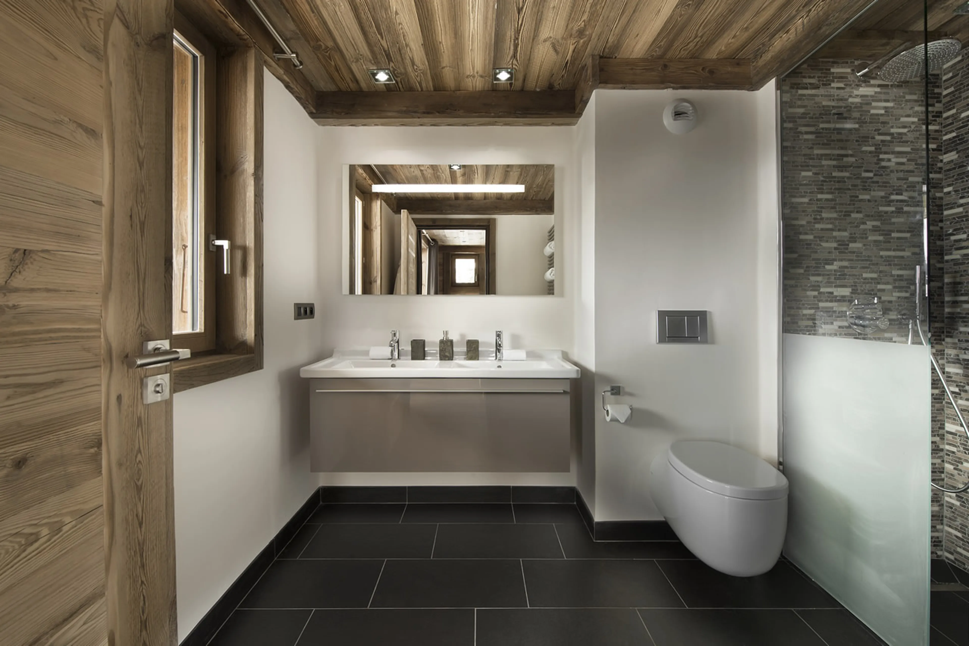 En-suite shower room with modern amenities in Chalet M in Courchevel 1550