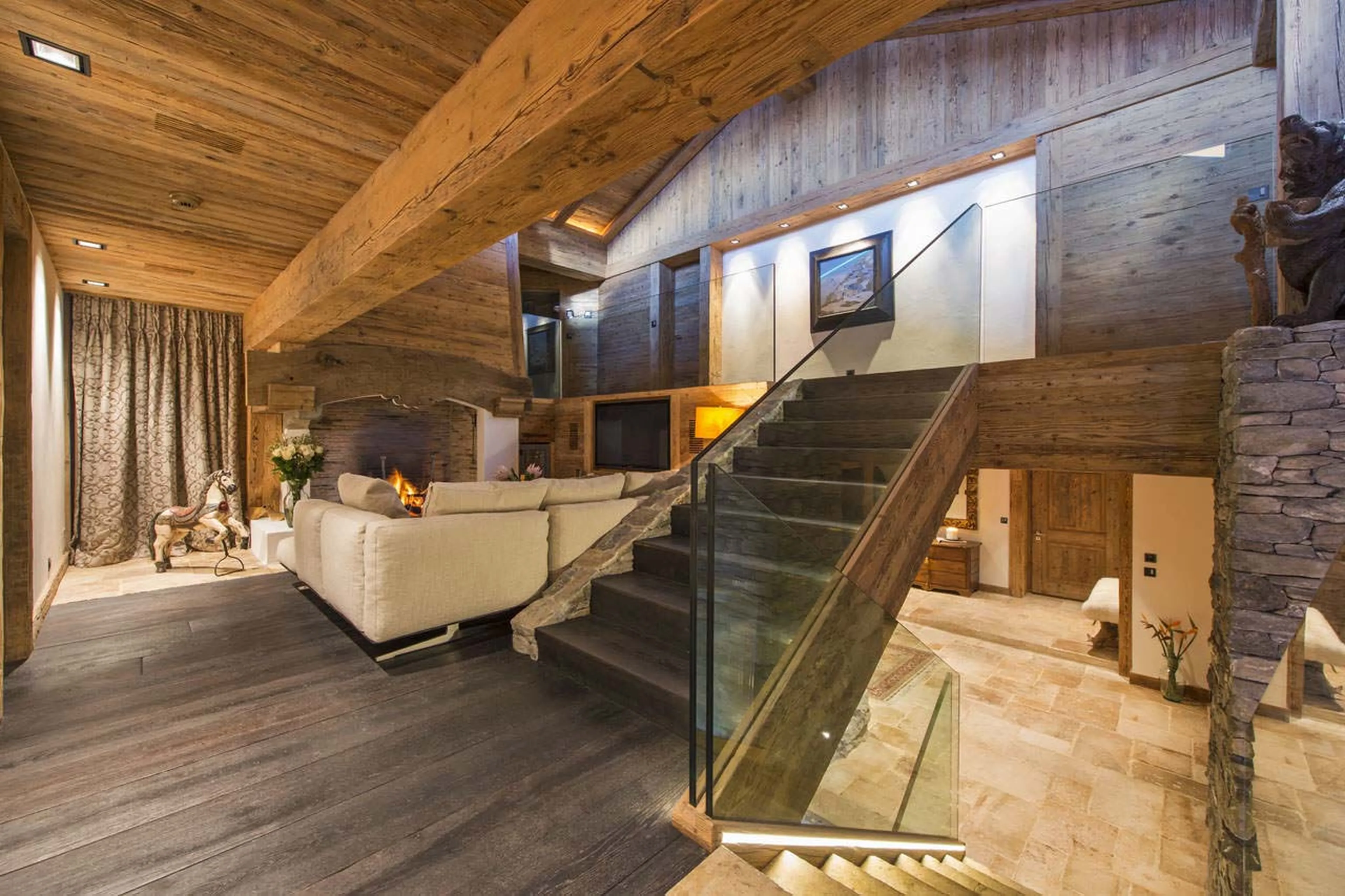 Tv lounge and staircase of Chalet Makini in Verbier