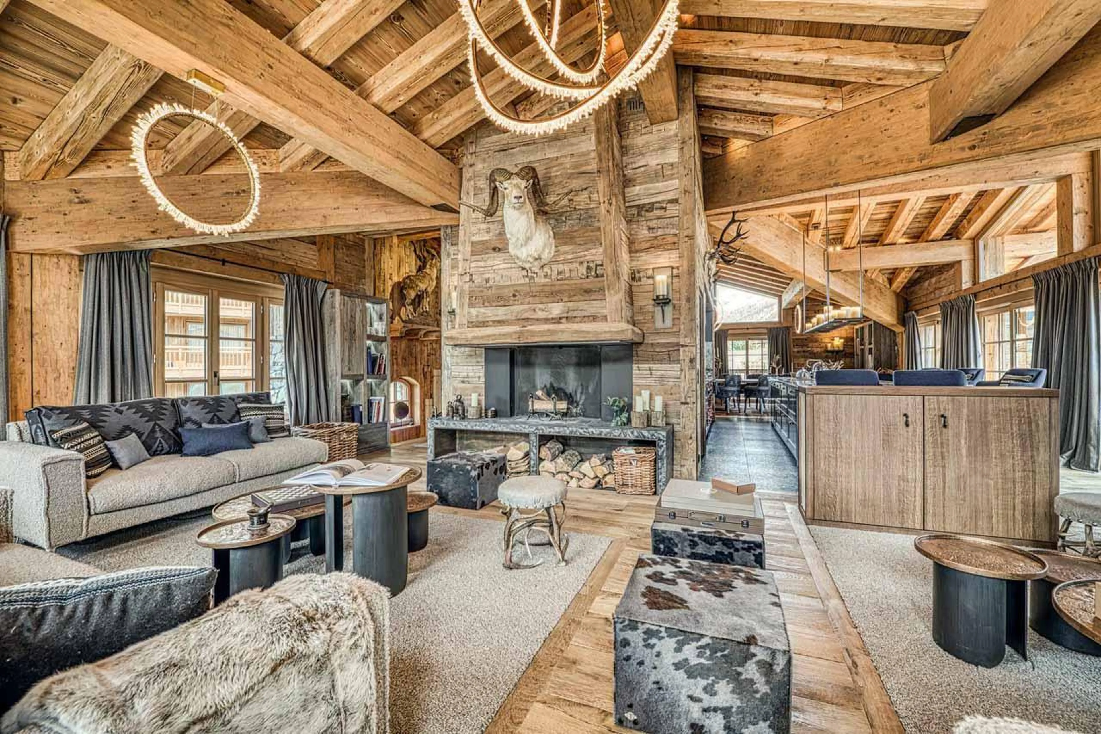 Living area with large fireplace in Chalet Markhor, Val d'Isere
