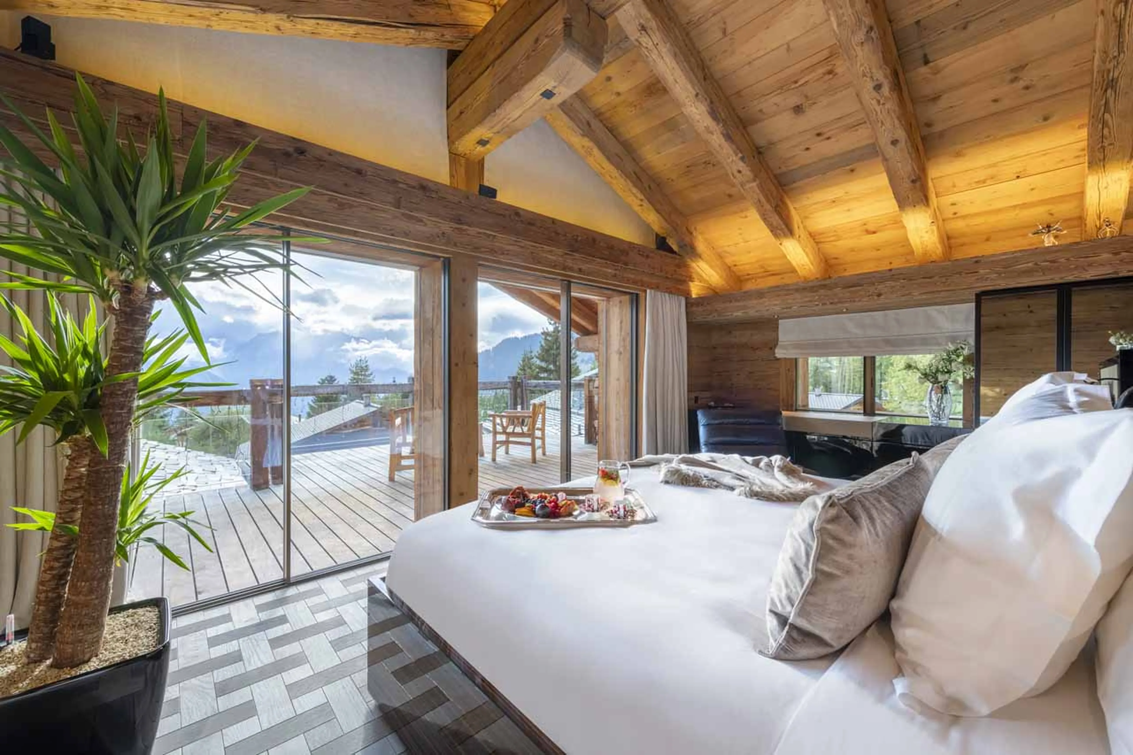 Access to private balcony from bedroom one at Chalet Marmottier in Verbier