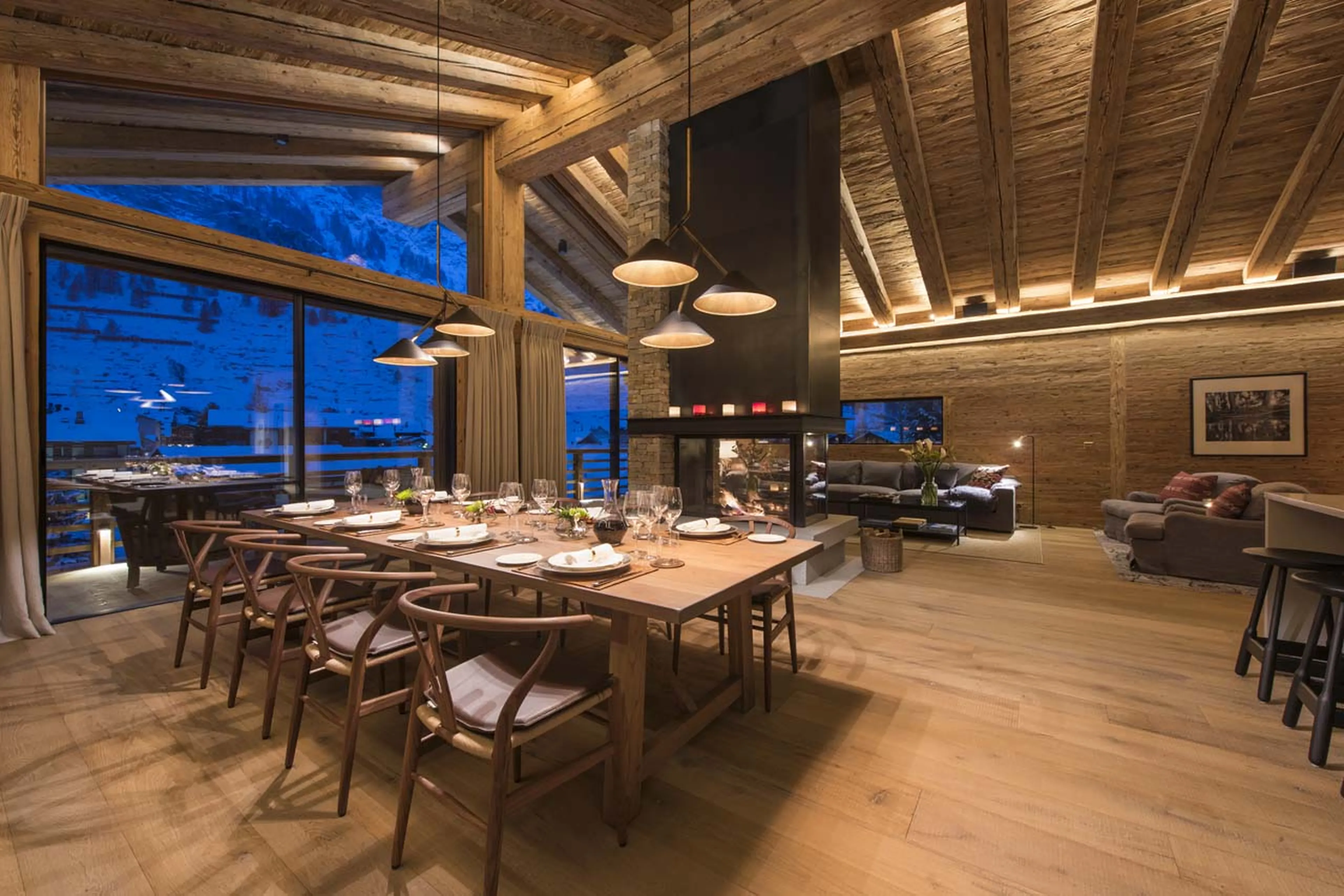 Dining area at night in Chalet Mckinley in Zermatt