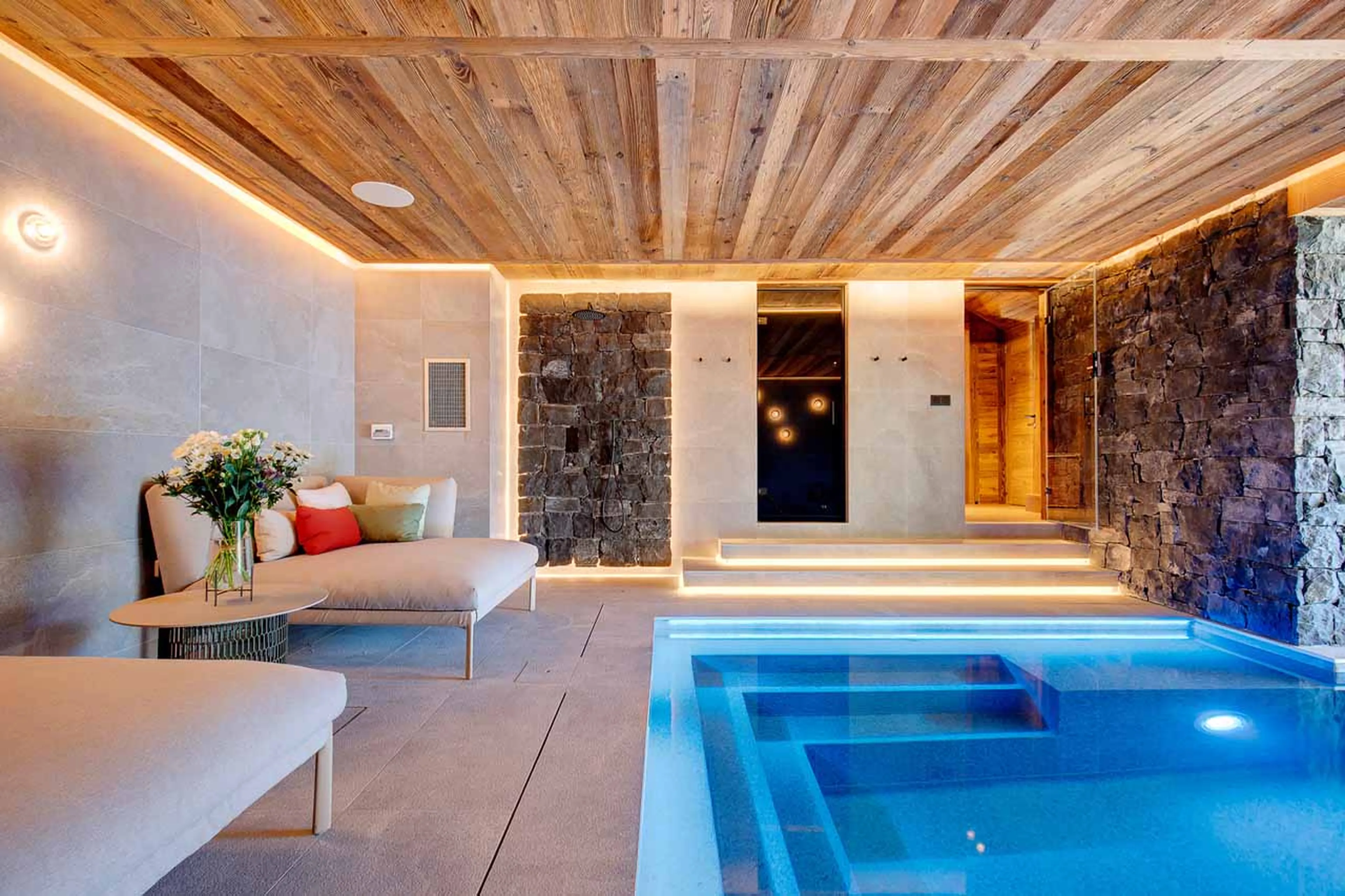 Relaxation area beside pool at Chalet Menor in Meribel