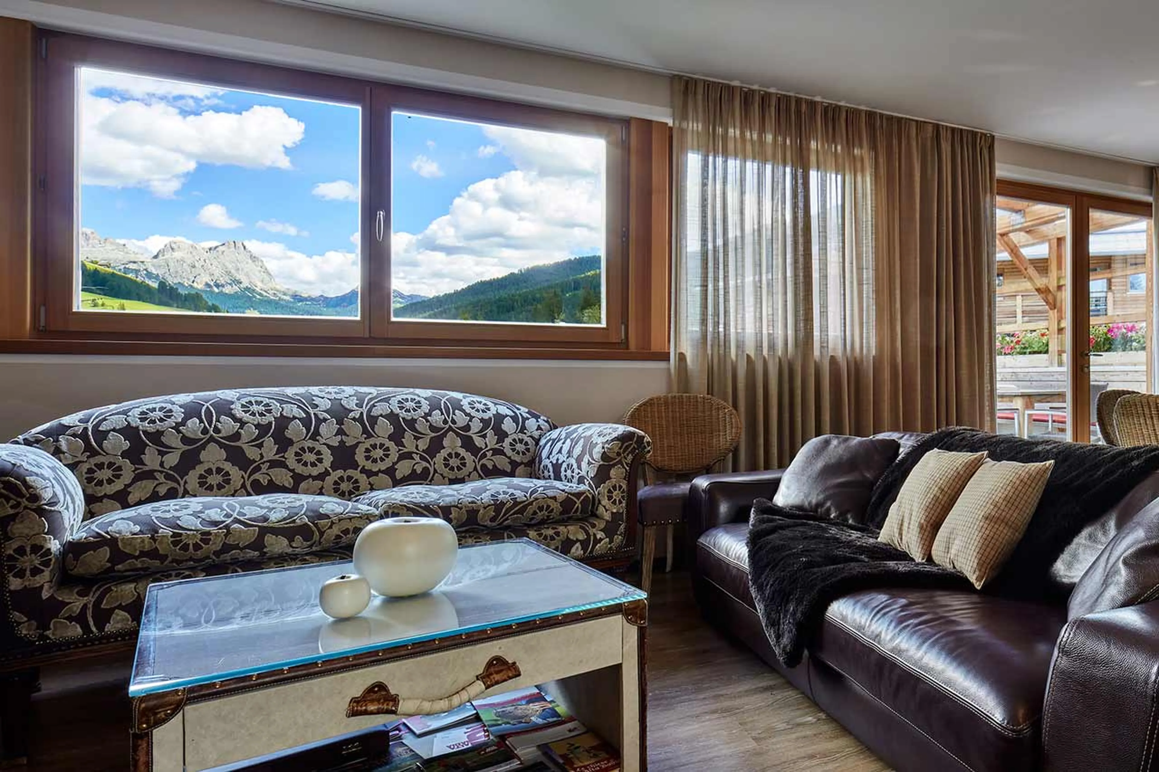 Comfortable sofas in living area at Chalet Mi Amur in Alta Badia